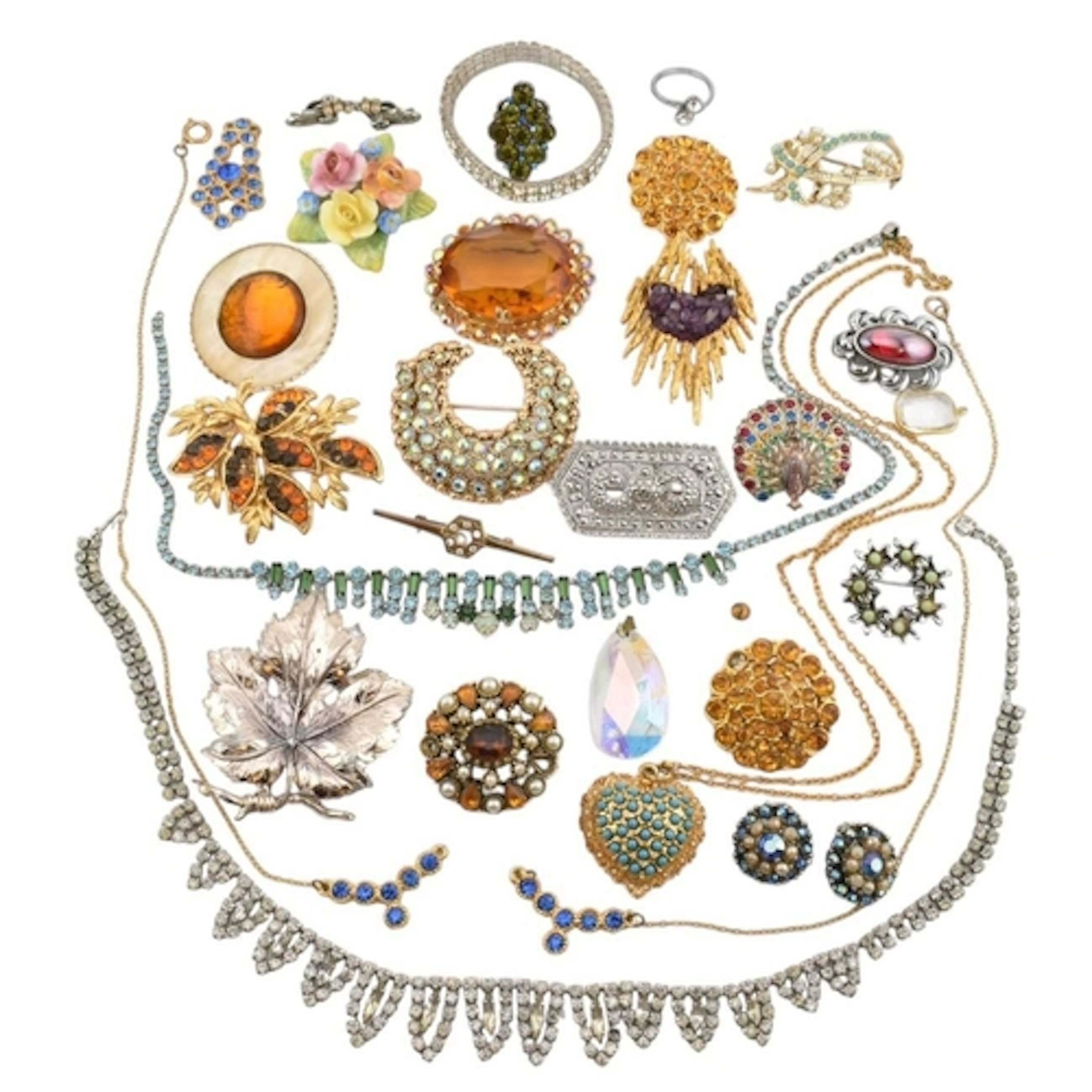 A collection of costume jewellery and brooch pins. Items to ...