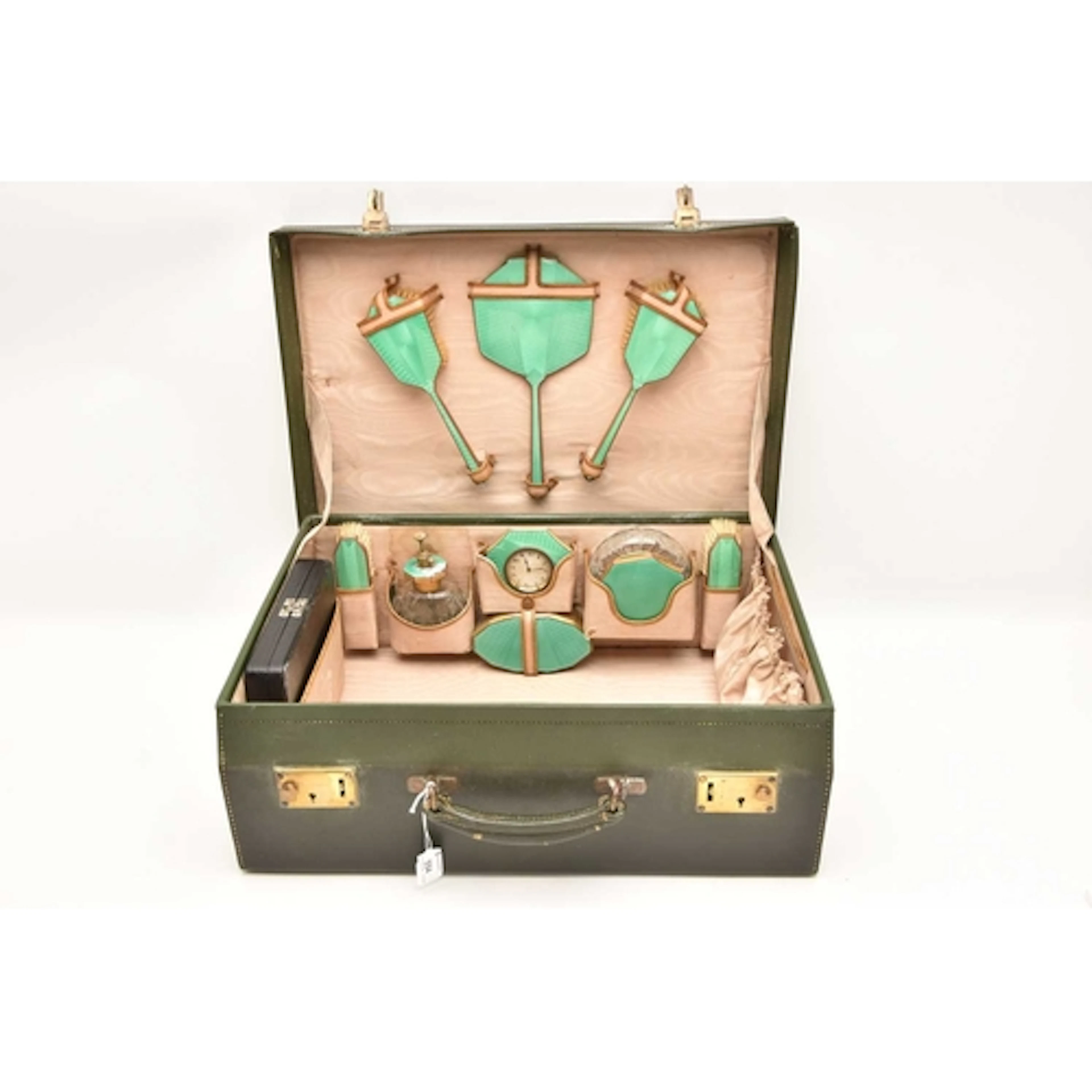 AN ART DECO TRAVELLING SUITCASE, comprising of a travel cloc...
