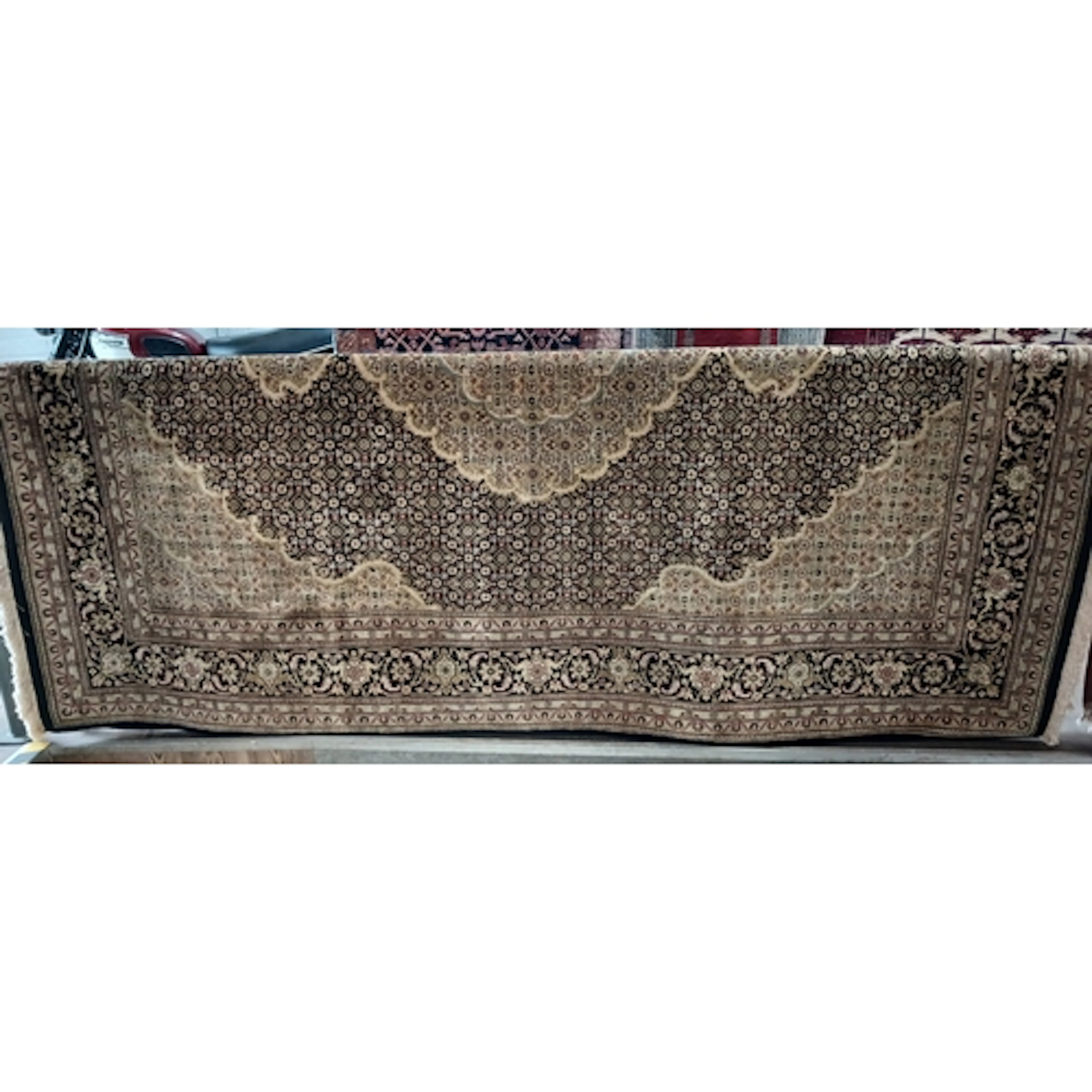 An eastern carpet 240cm x 180cm.