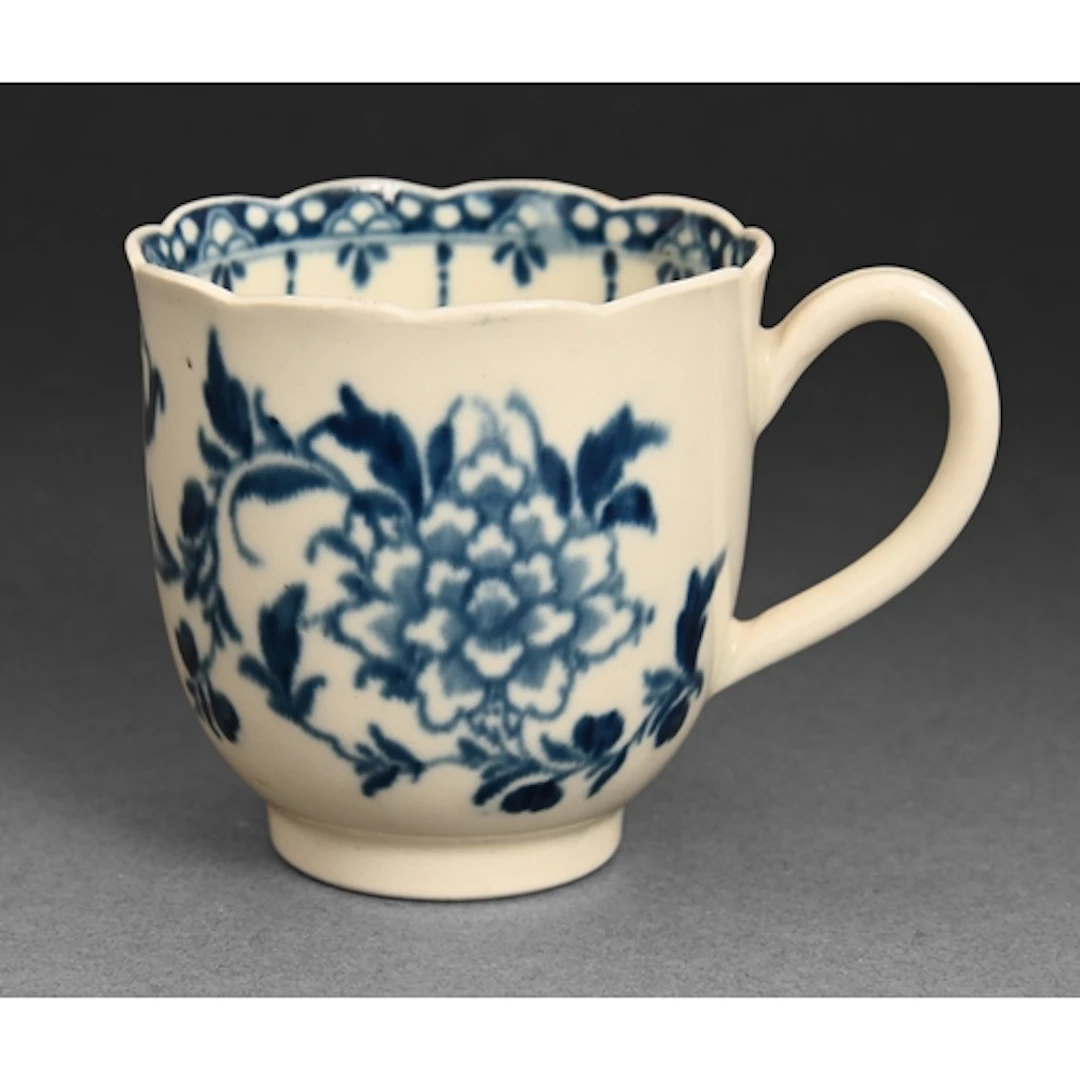 A Worcester blue and white coffee cup, c1770, painted with t...