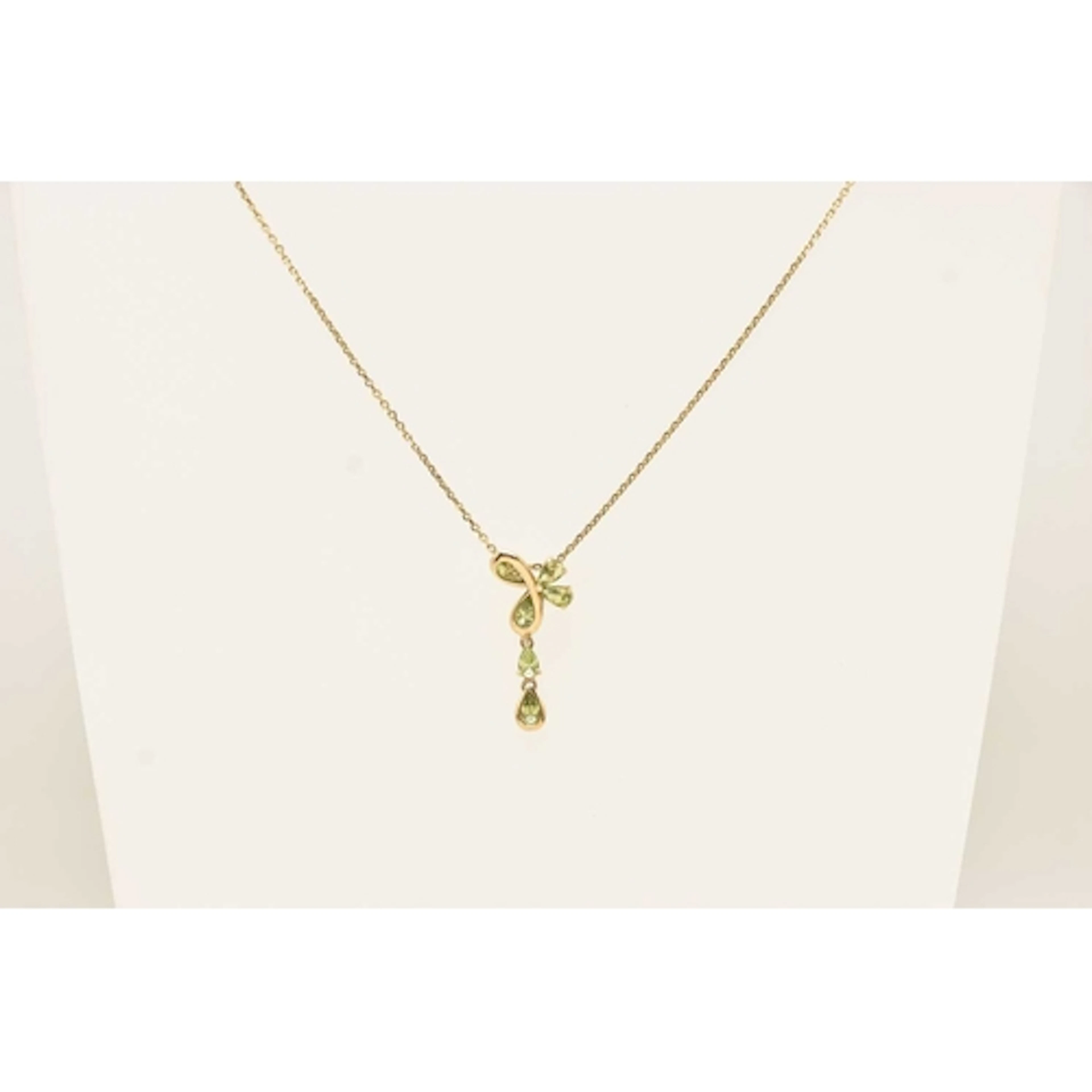 A 9CT YELLOW GOLD GEM SET PENDANT NECKLACE, pear cut peridot...