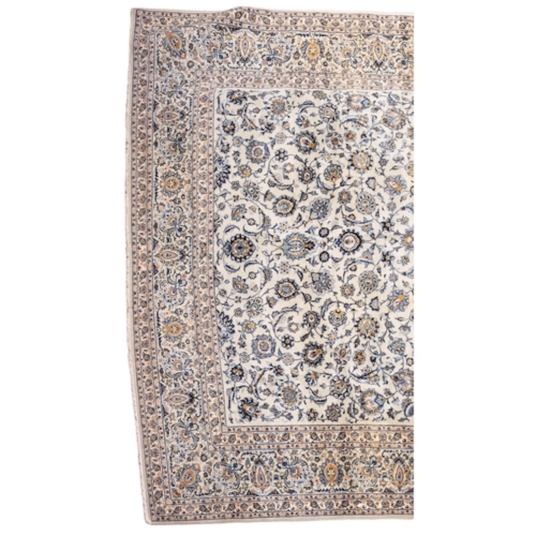 A Kashan carpet, the blue/grey field with an all over design...