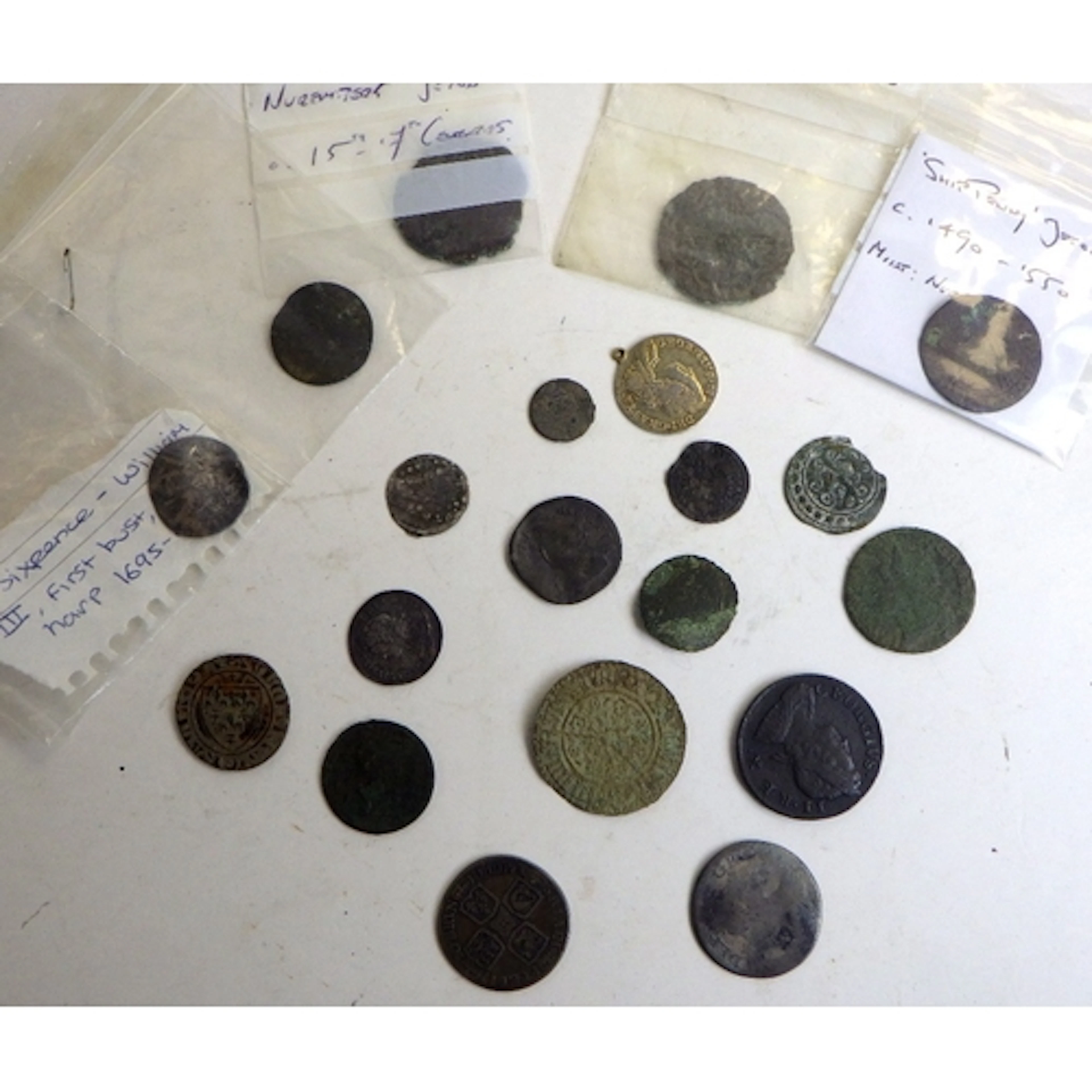 A collection of five later Stuart and early Georgian coins; ...