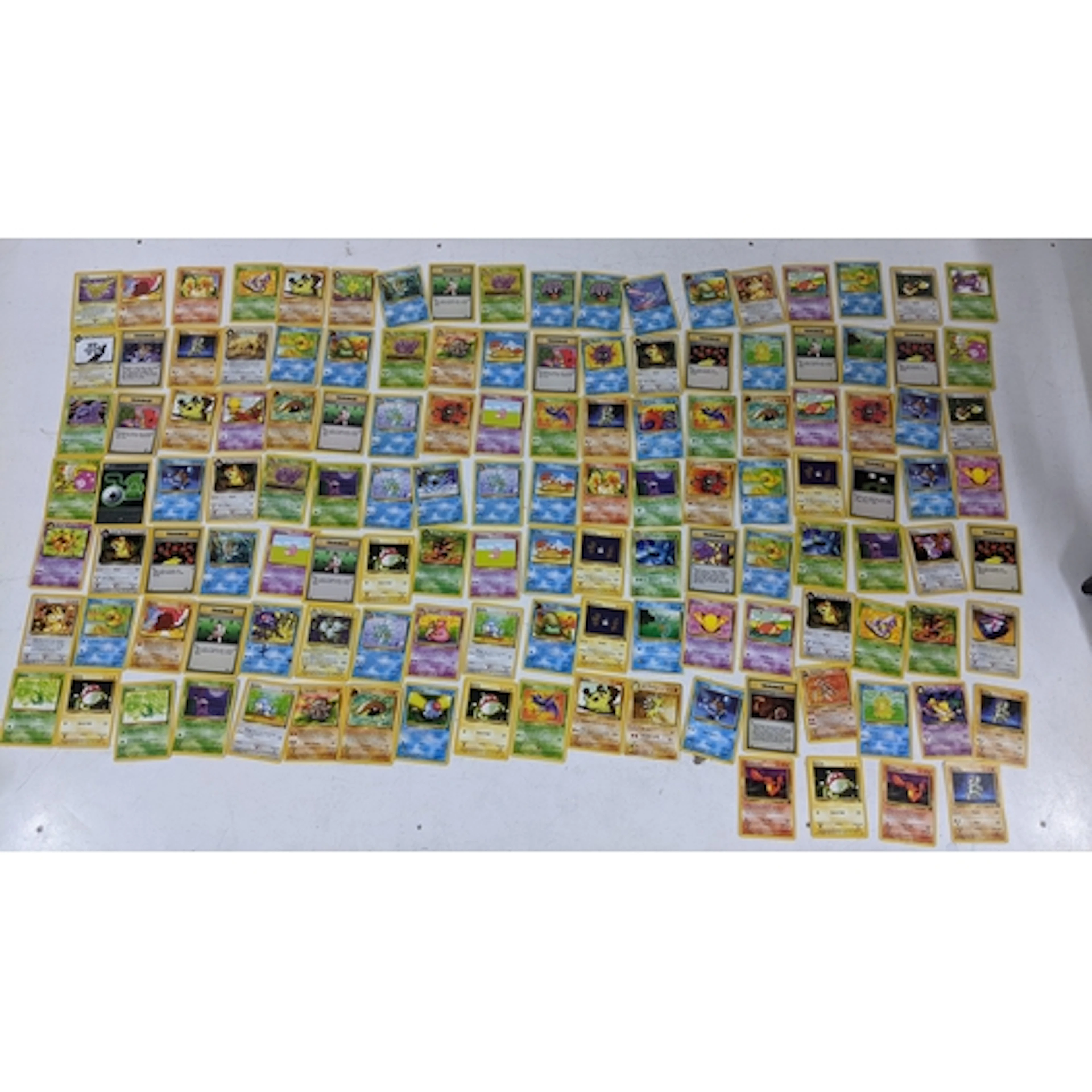 A collection of Pokemon cards, fossil set and Team Rocket to...