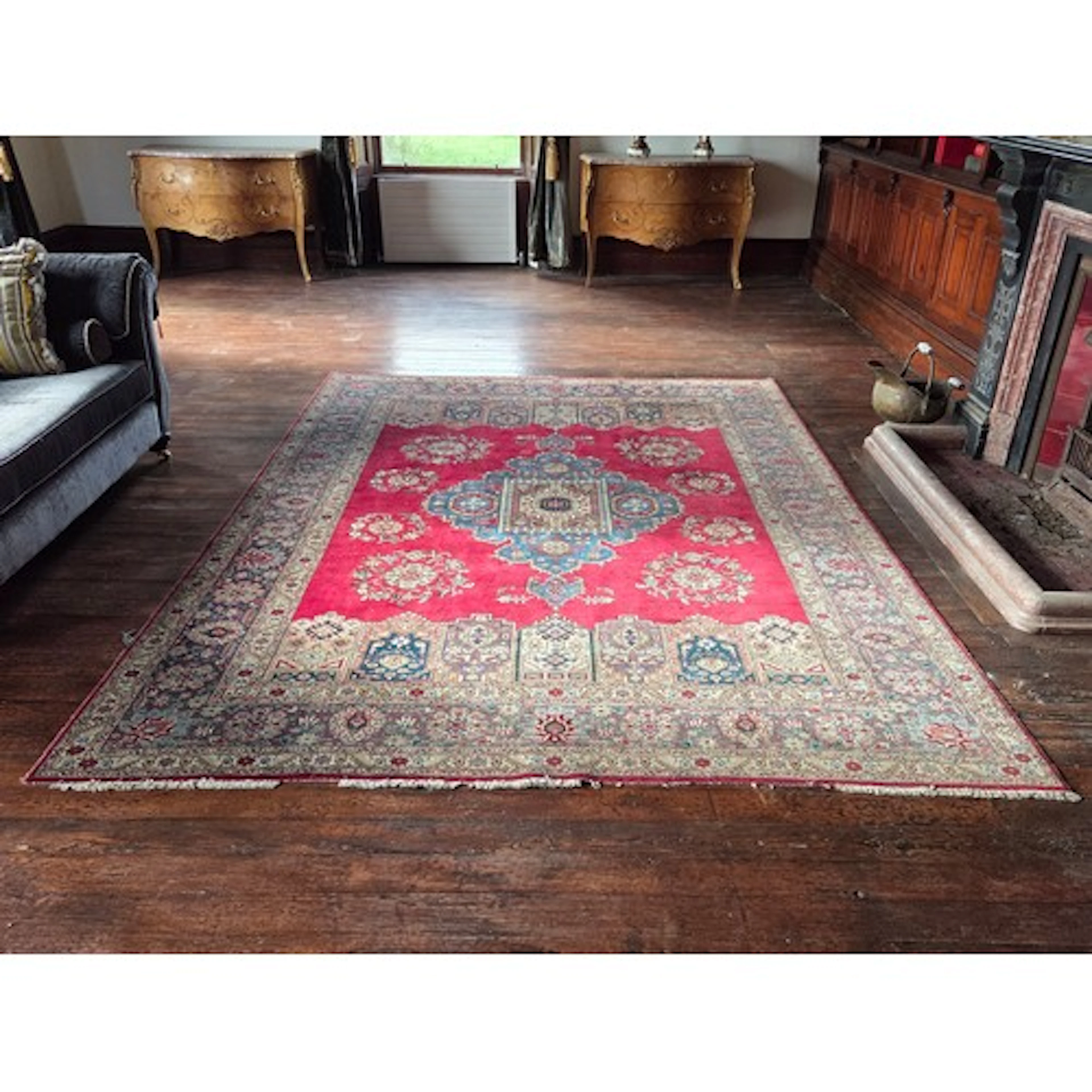 A large Persian Red ground Persian Kashan Carpet with large ...