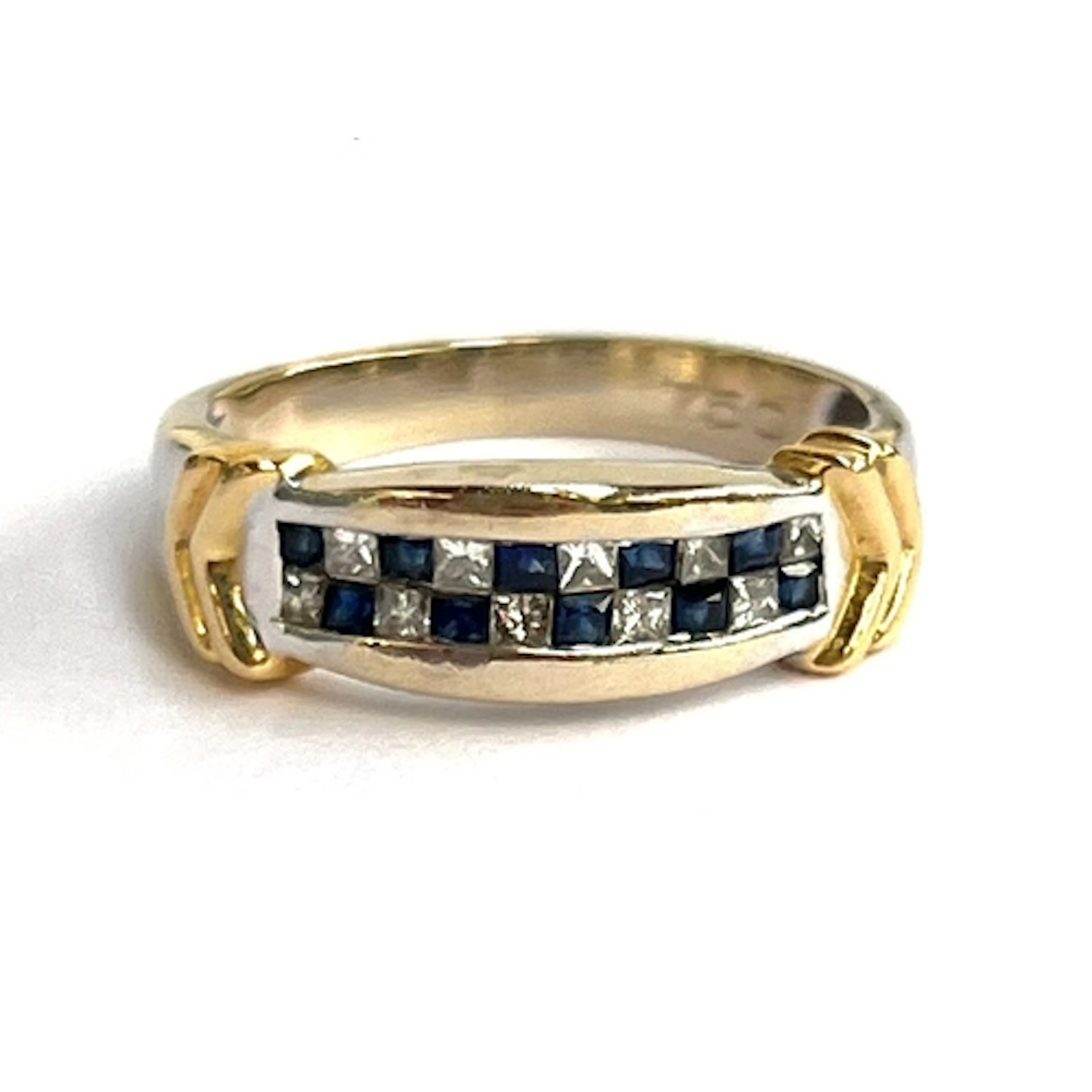 An 18ct yellow and white gold ring set with a checkerboard d...