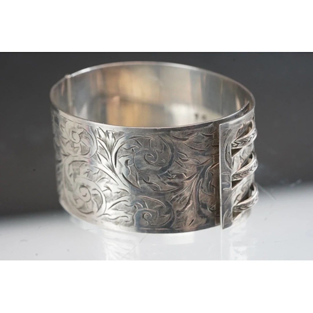 A fully hallmarked sterling silver hinged wide cuff bangle, ...