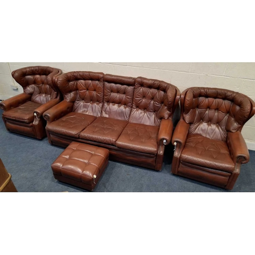 A RED LEATHER FOUR PIECE WING BACK LOUNGE SUITE, comprising ...