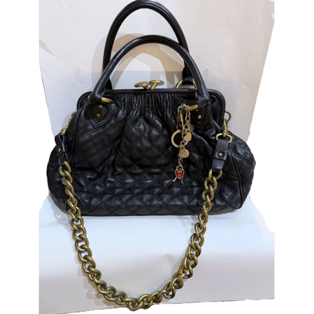 A Marc Jacobs quilt effect dark blue leather handbag with do...