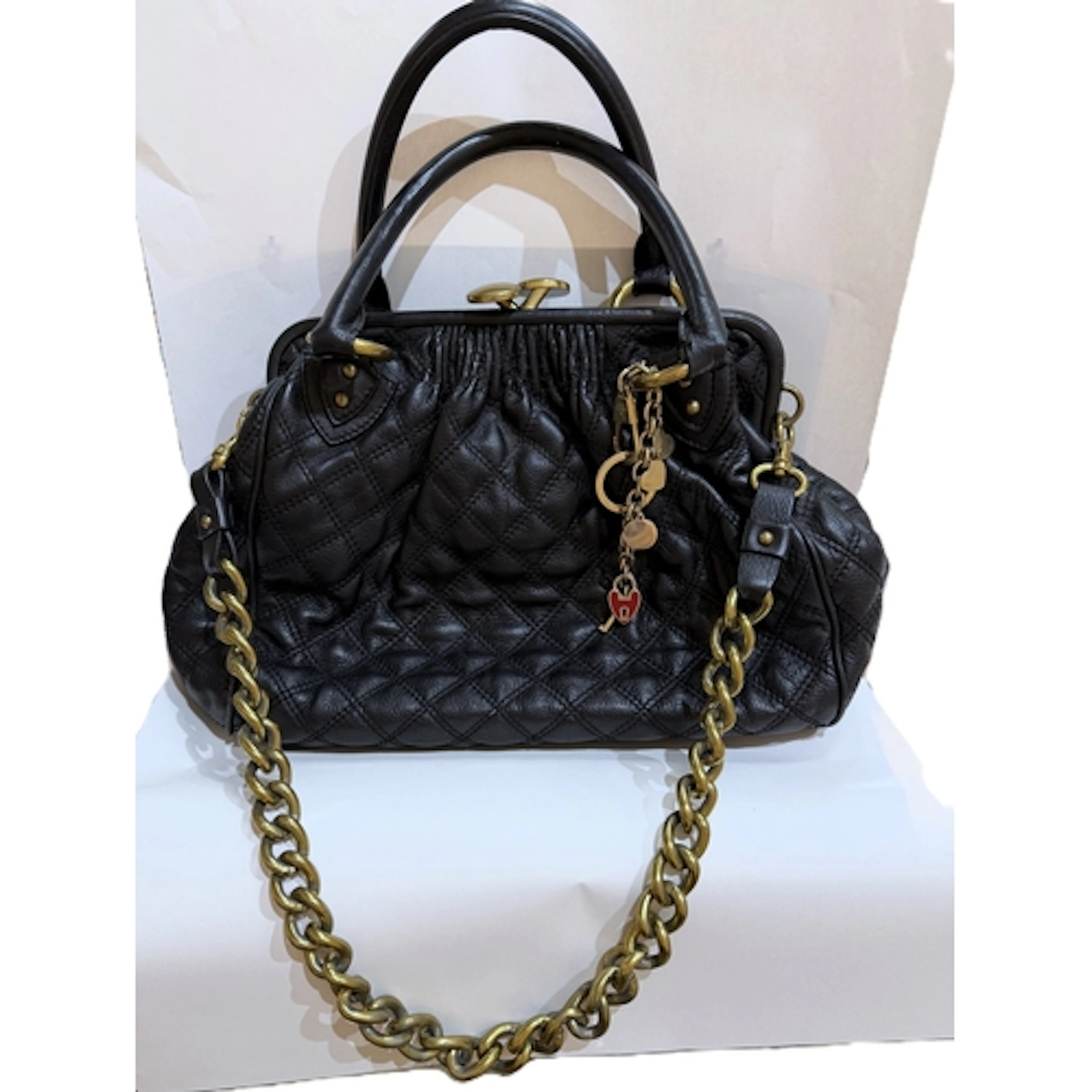 A Marc Jacobs quilt effect dark blue leather handbag with do...