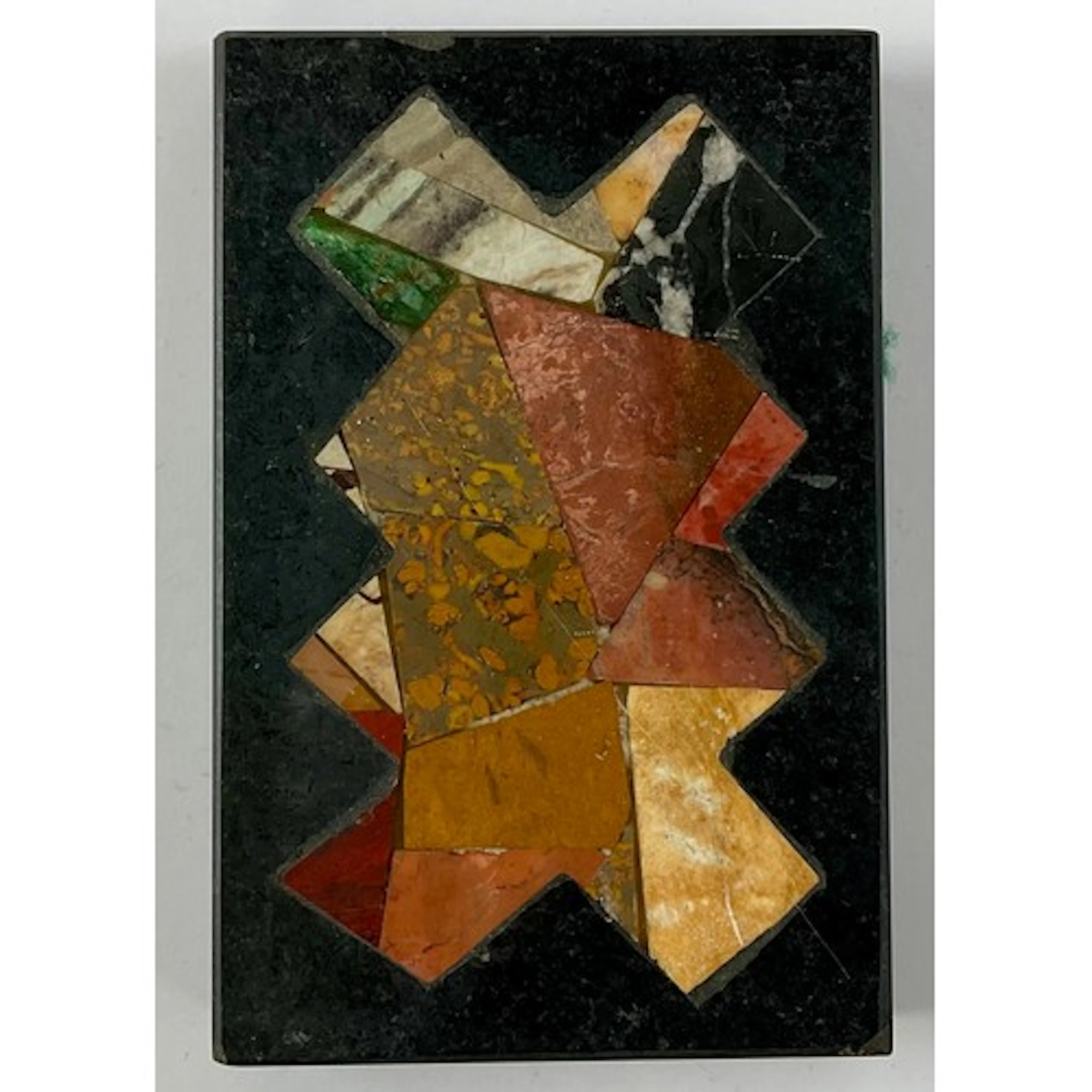 A black marble rectangular desk weight, pietra dura inlaid w...