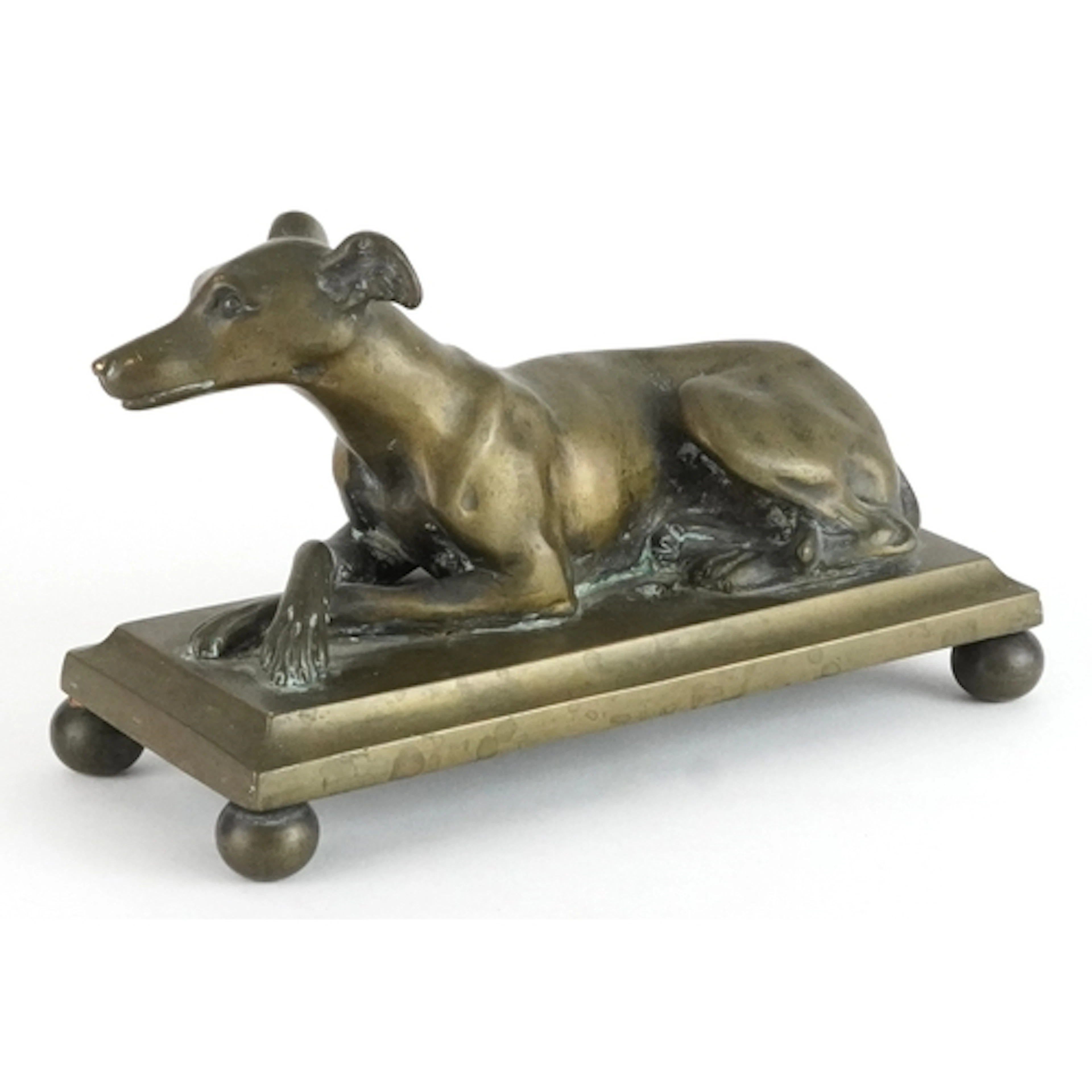 19th century brass study of a recumbent Greyhound, 18cm in l...