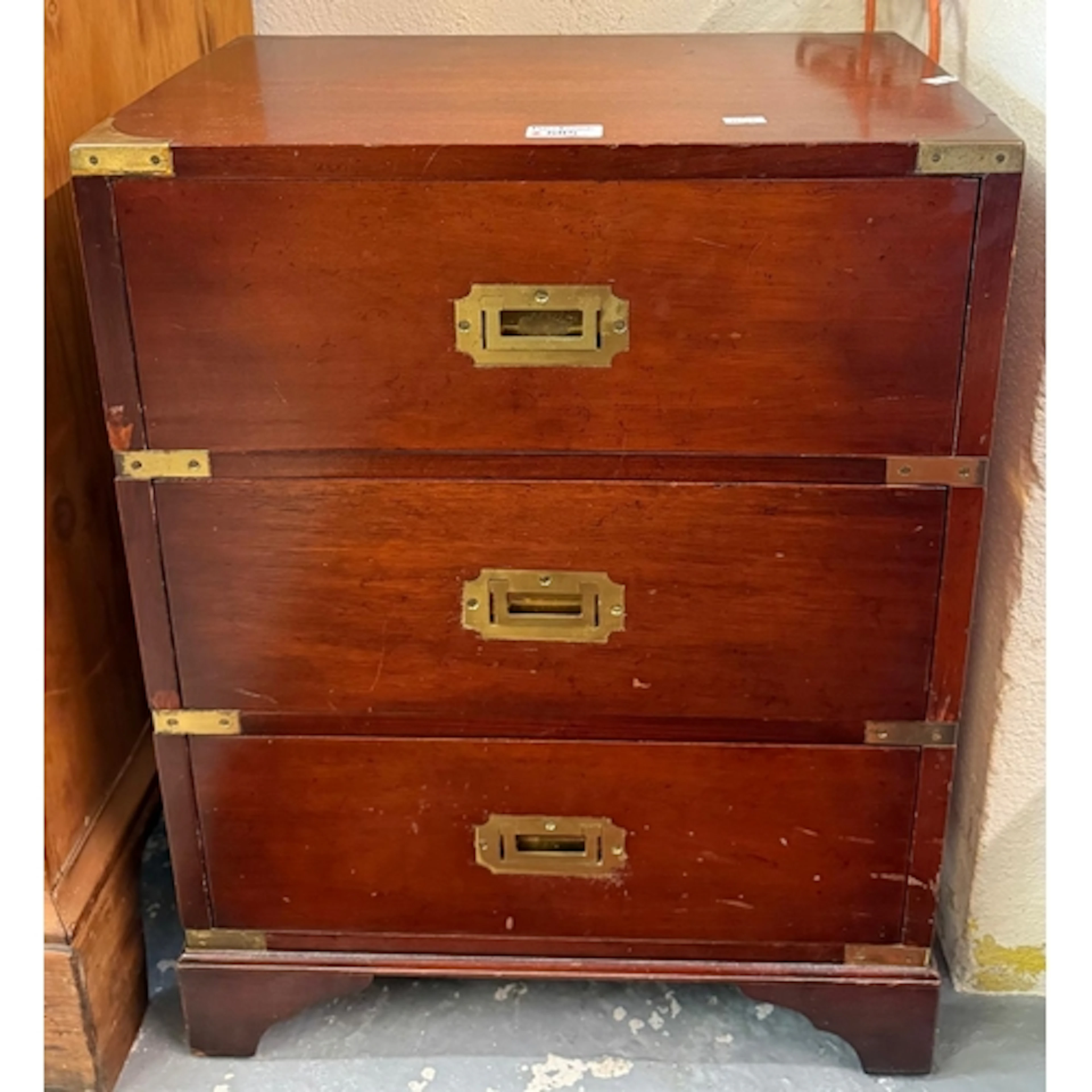Reproduction mahogany bedside chest of three drawers having ...