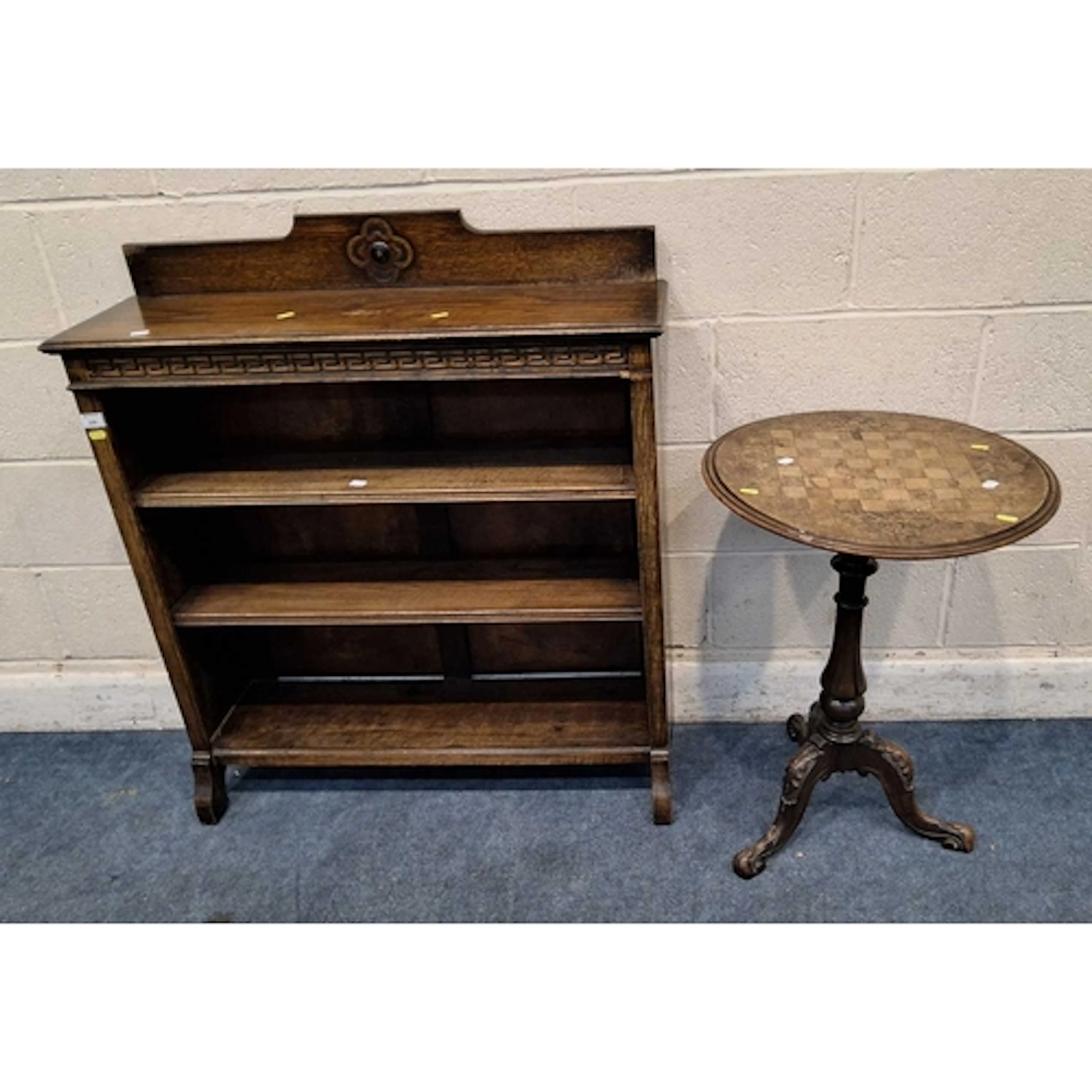 AN EARLY 20TH CENTURY OAK OPEN BOOKCASE, with geometric patt...