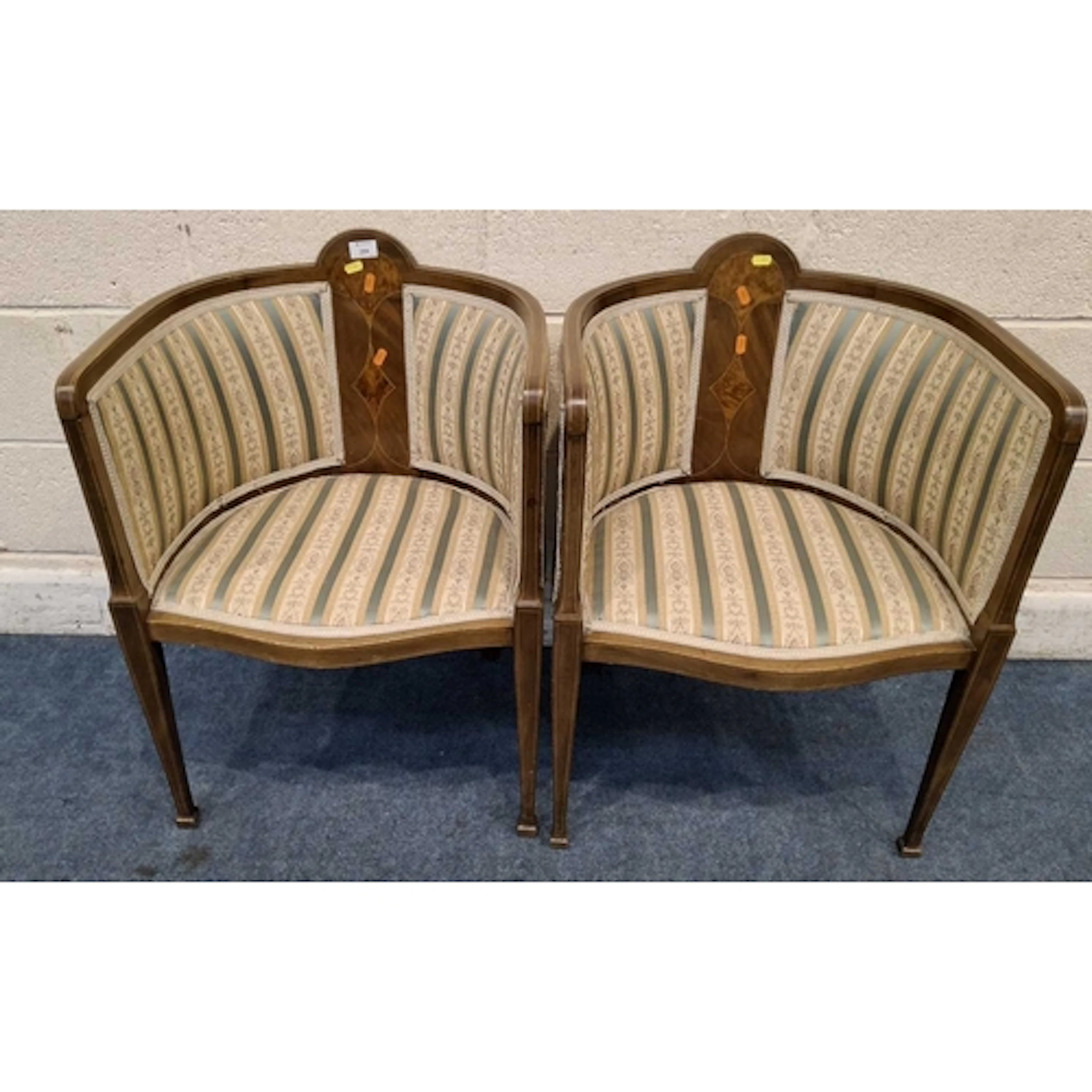 A PAIR OF EDWARDIAN MAHOGANY CHAIRS, with stripped and folia...