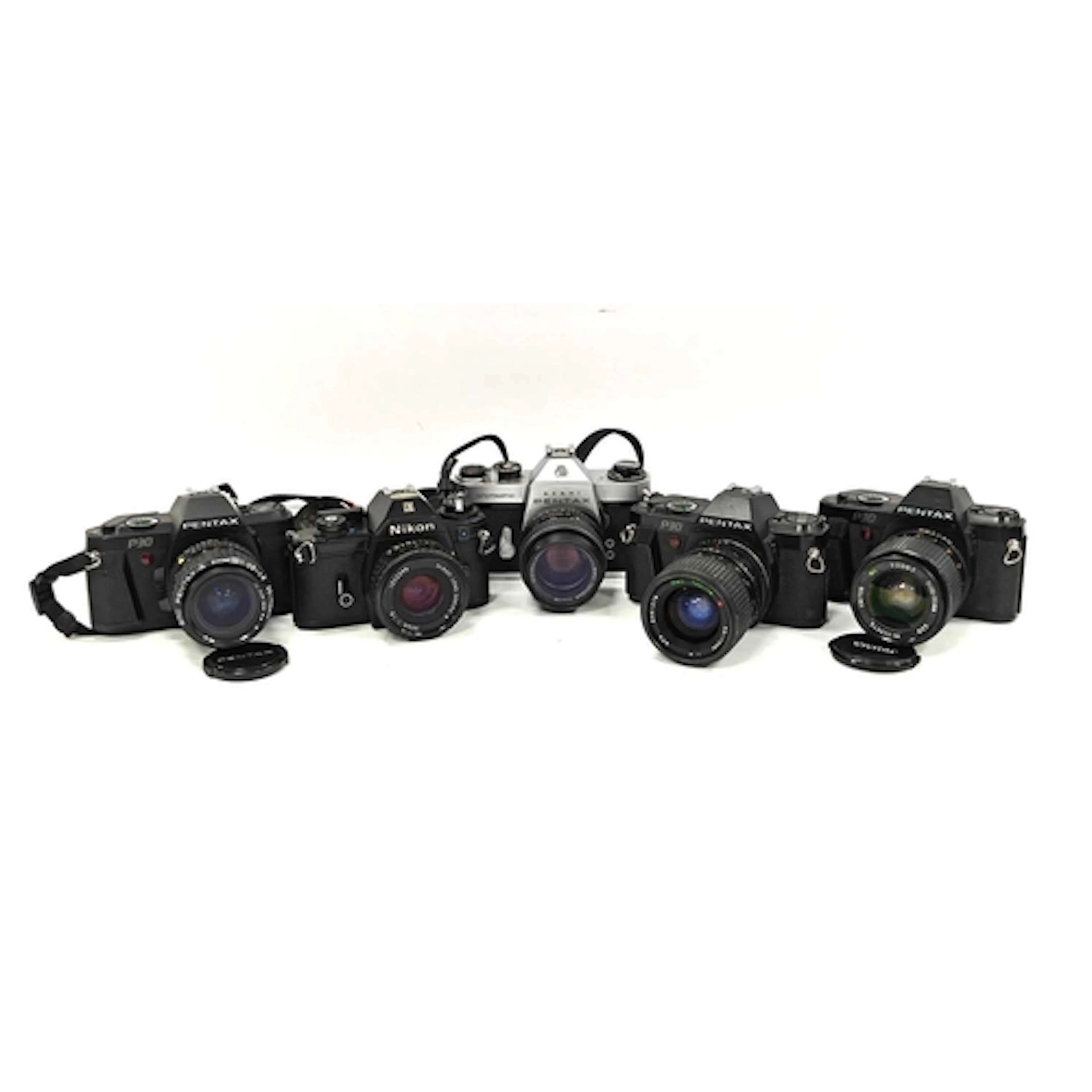 Five 35mm SLR Film Cameras all with attached lenses. Compris...
