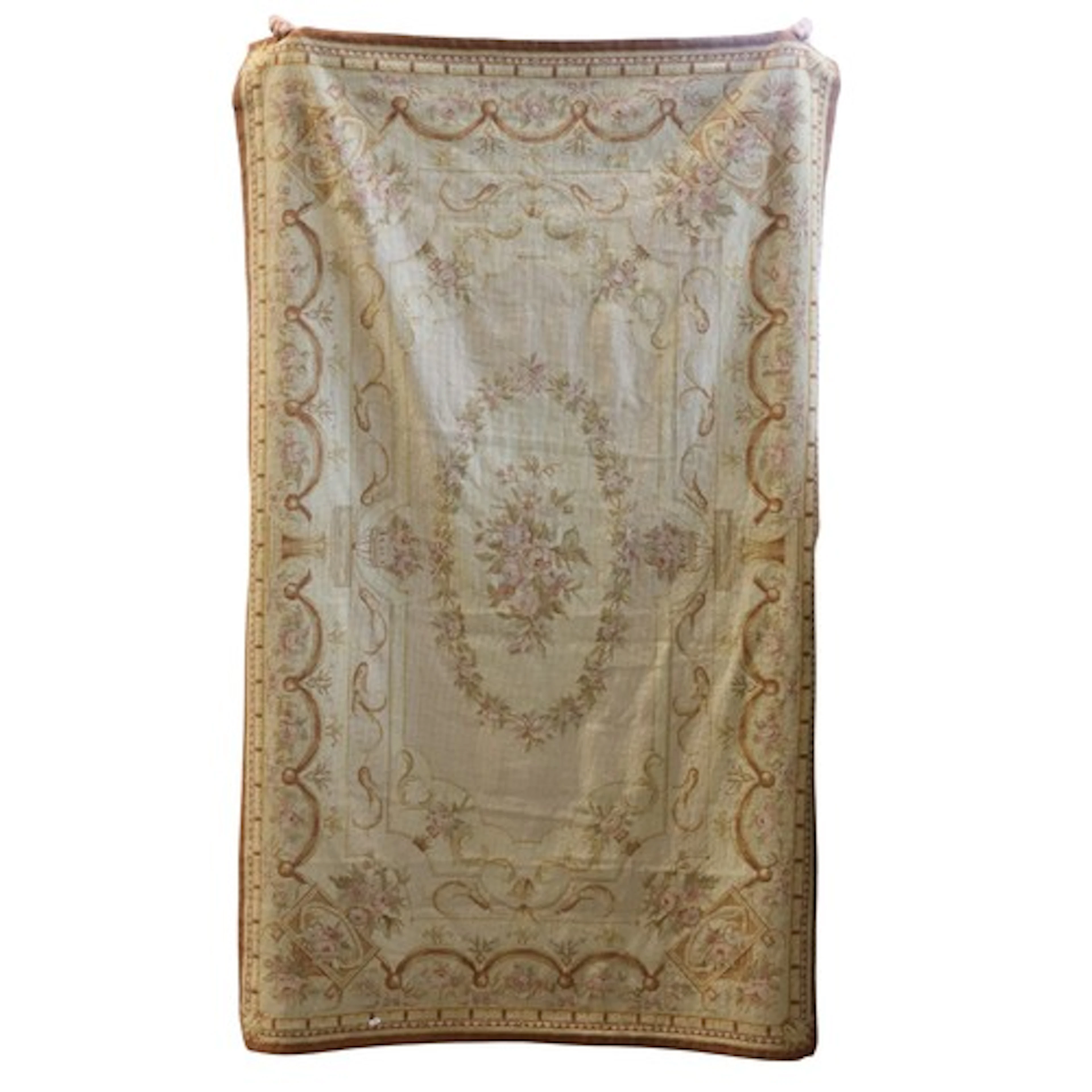 A needlepoint rug in the Aubusson style in pastel shades wit...