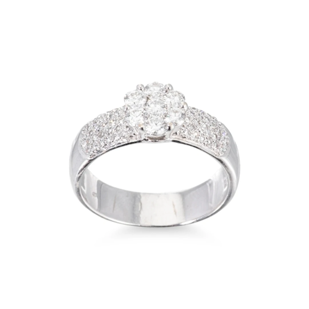 A DIAMOND DAISY CLUSTER RING, to diamond shoulders, mounted ...