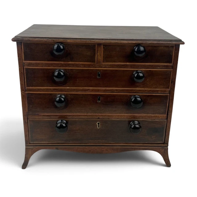 AN ANTIQUE MINIATURE MAHOGANY APPRENTICE'S CABINET Two short...