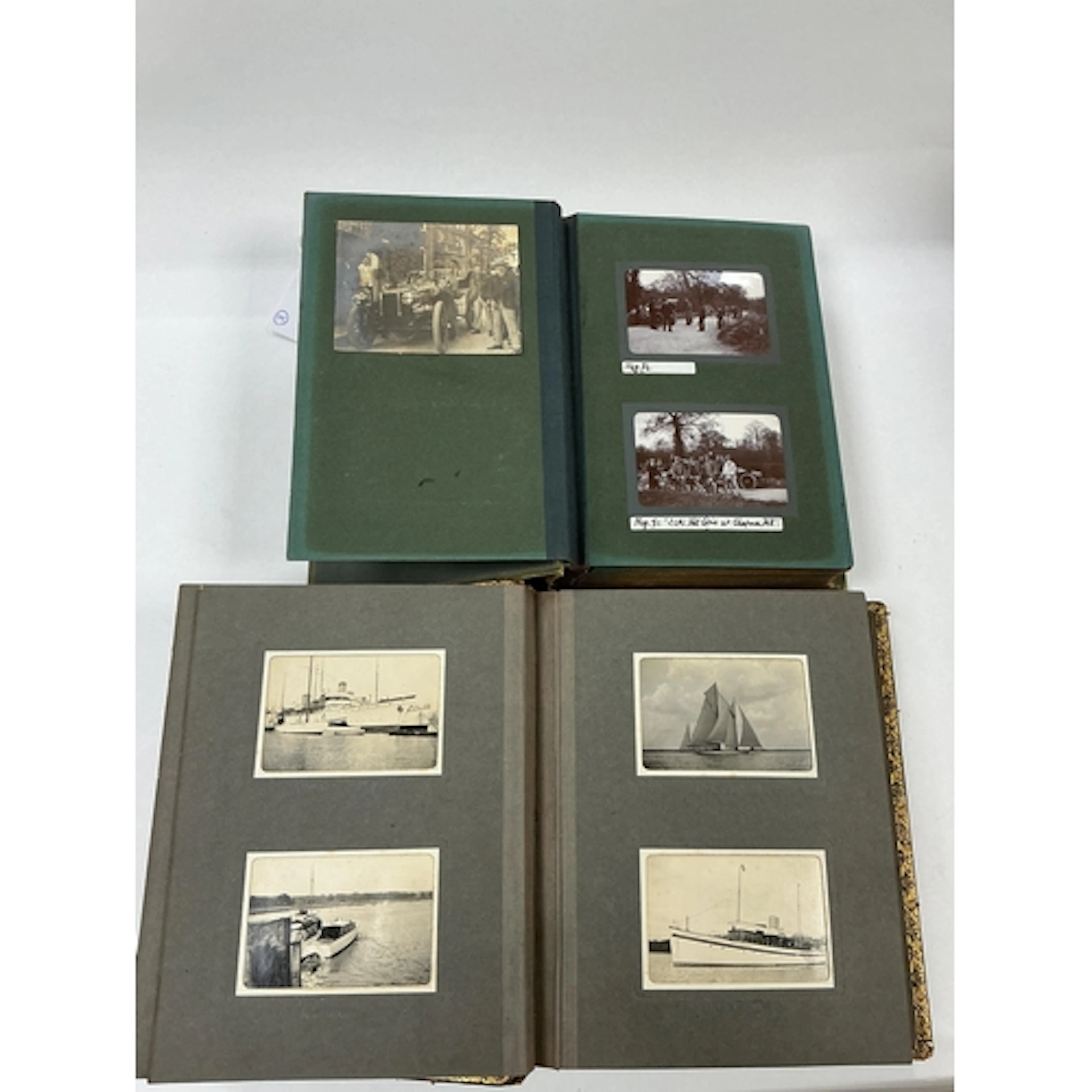 Two 1950s photograph albums of transport, one of motoring re...