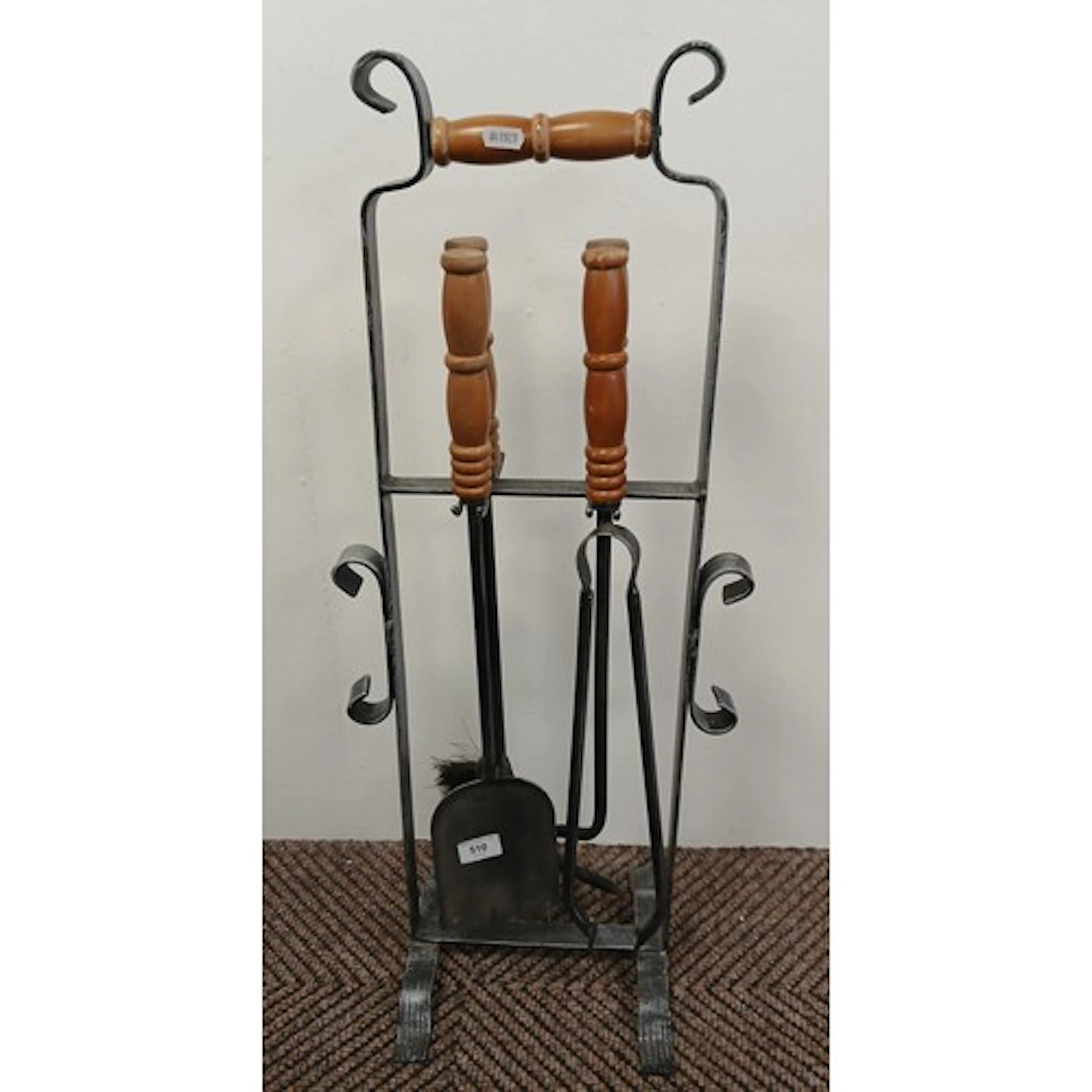 Metal four piece companion set on stand.