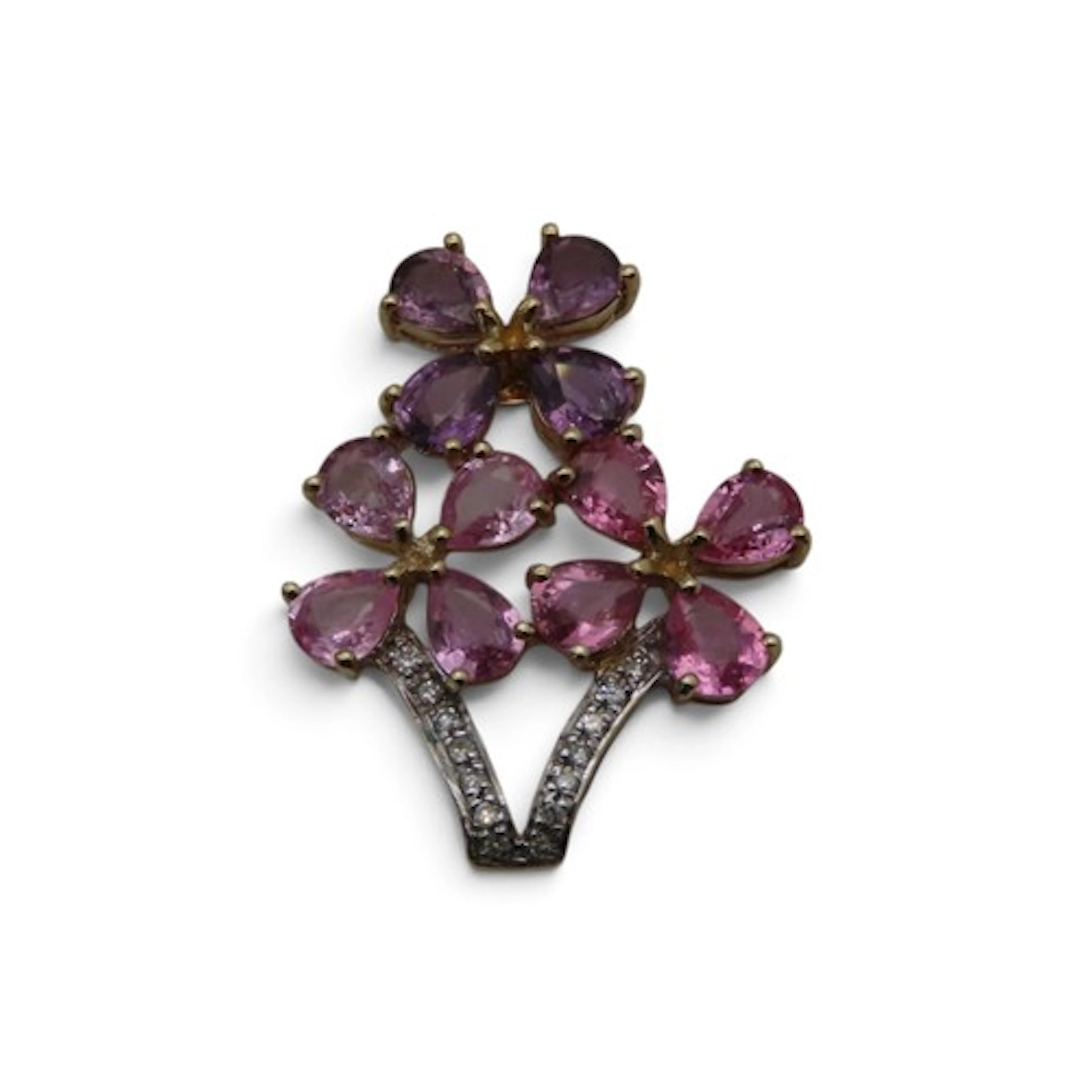 A gem-set floral spray pendant, by Rocks & Co., composed of ...
