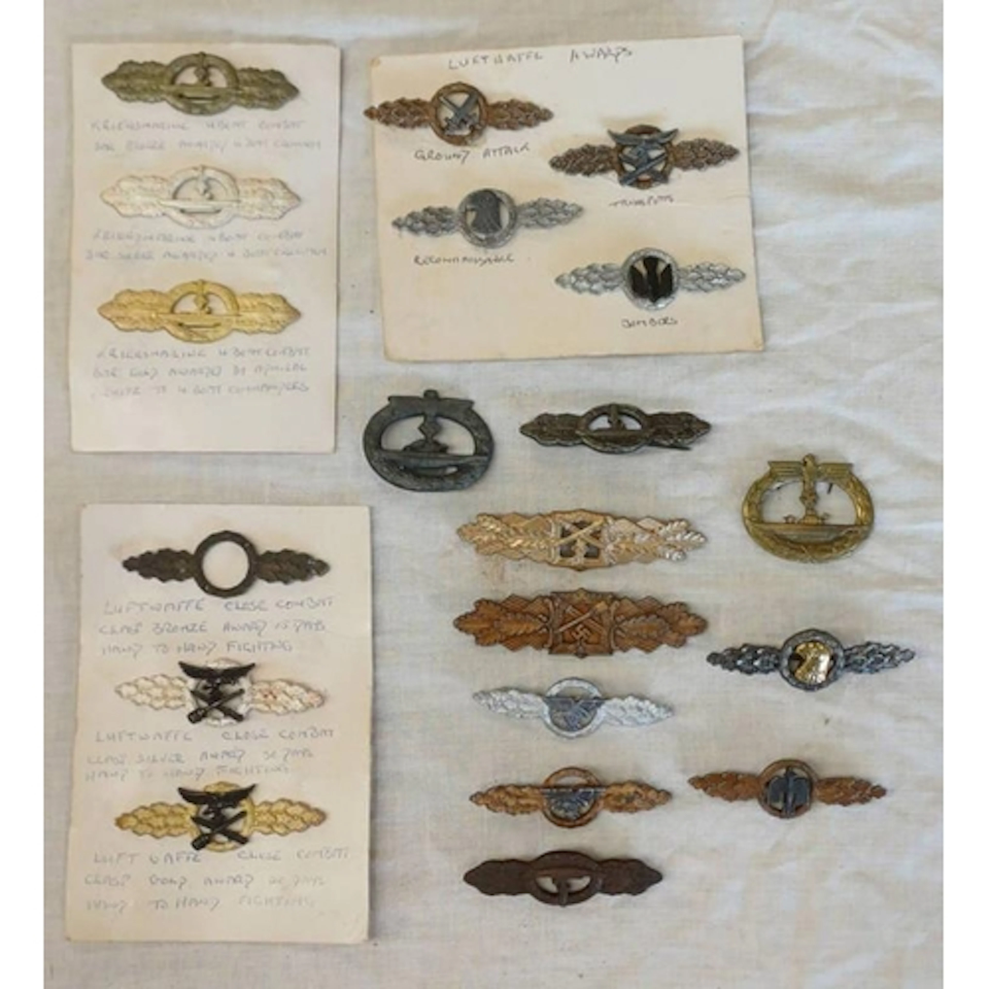 SELECTION OF REPRODUCTION GERMAN WW2 CLASPS & BADGES TO INCL...