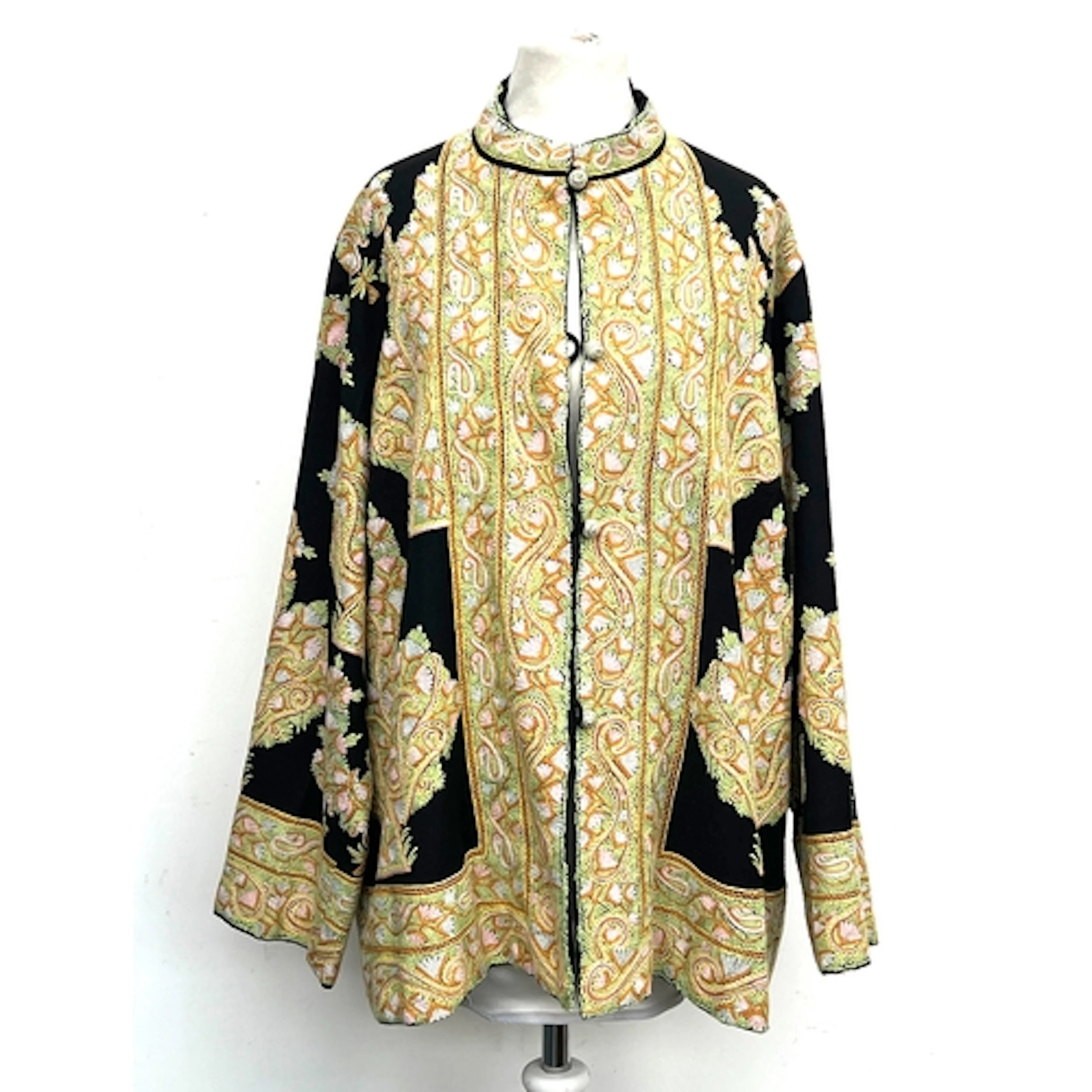 A vintage black wool jacket with multicoloured dense embroid...