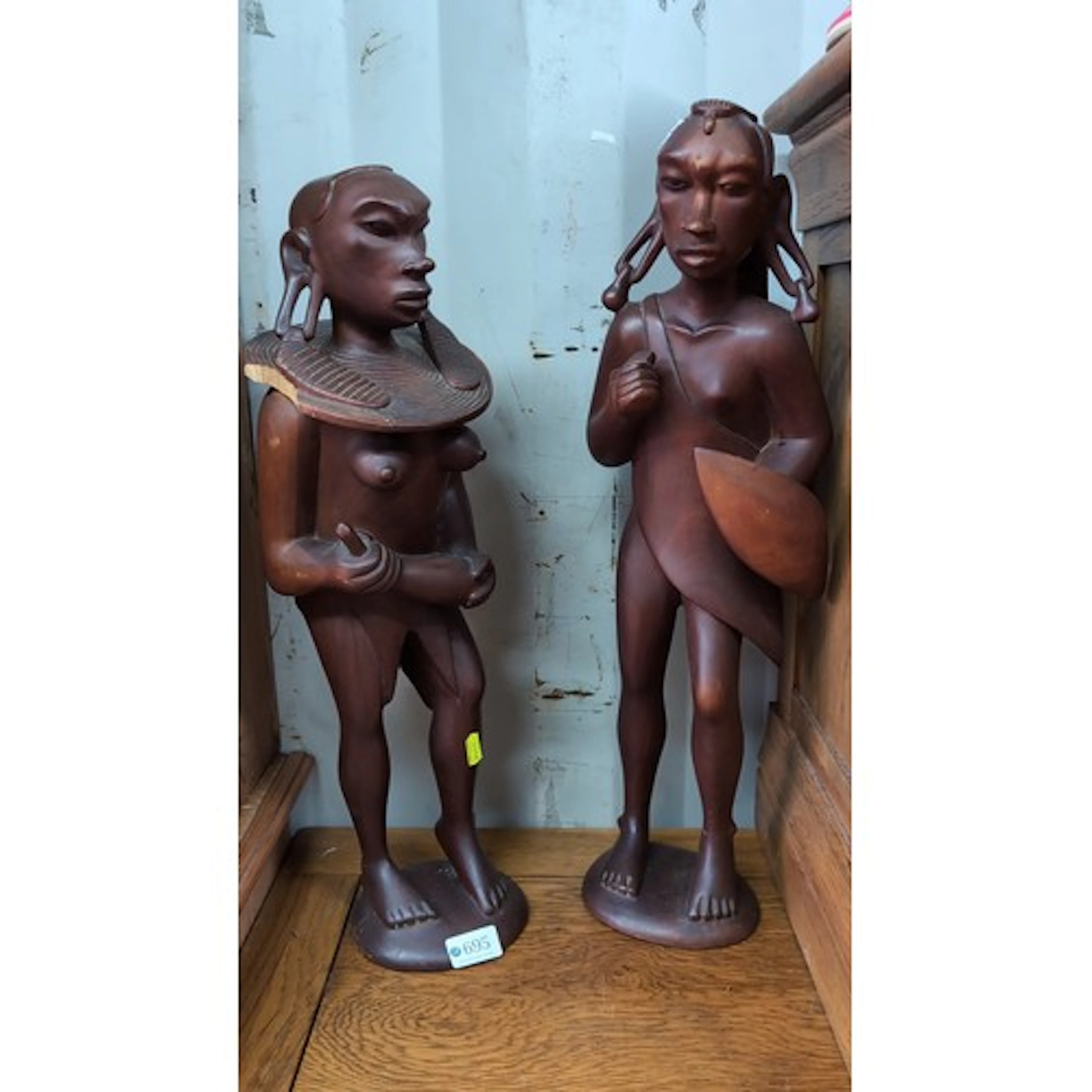 A pair of carved hardwood standing female figures, African s...