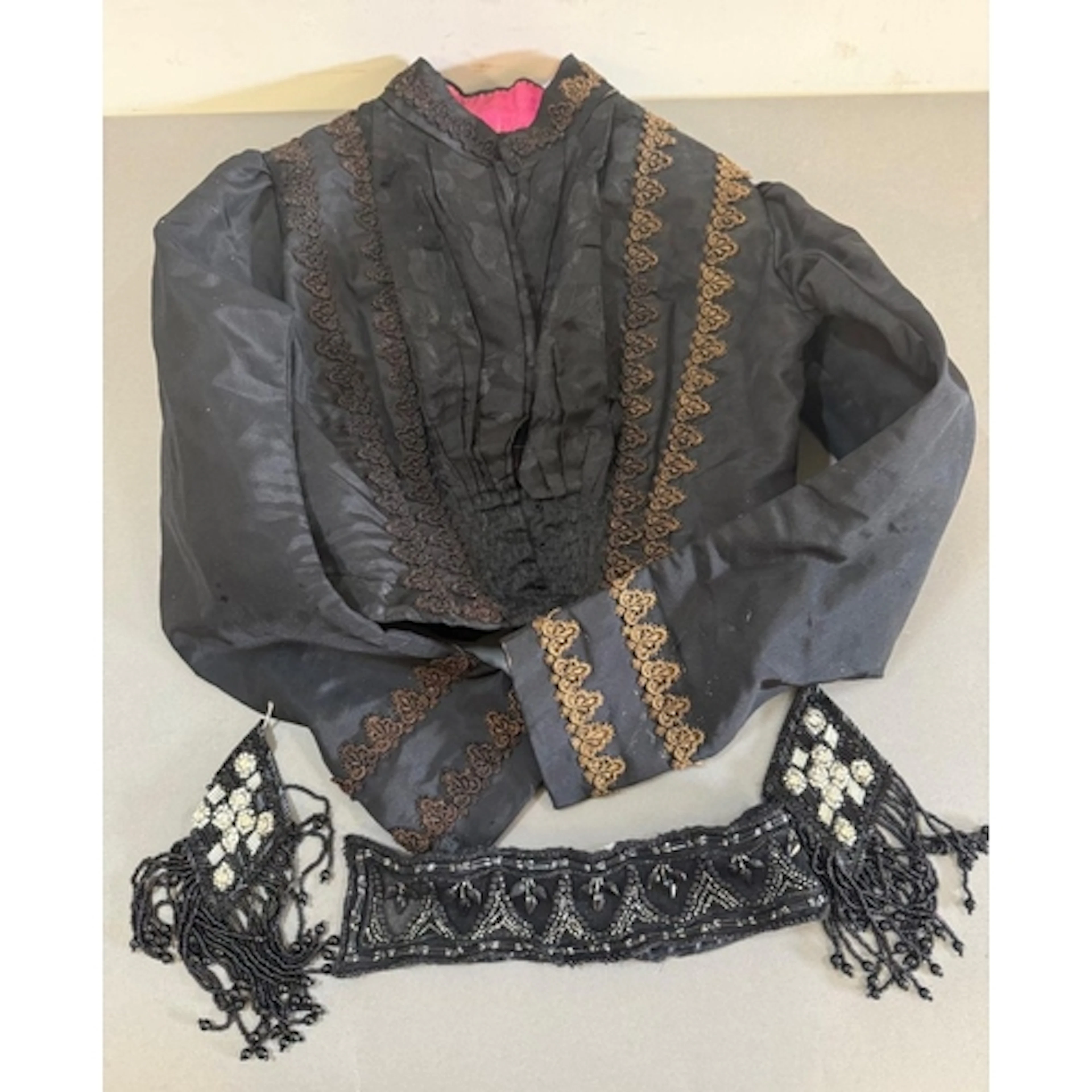 A black and gold braid Victorian bodice along with a selecti...