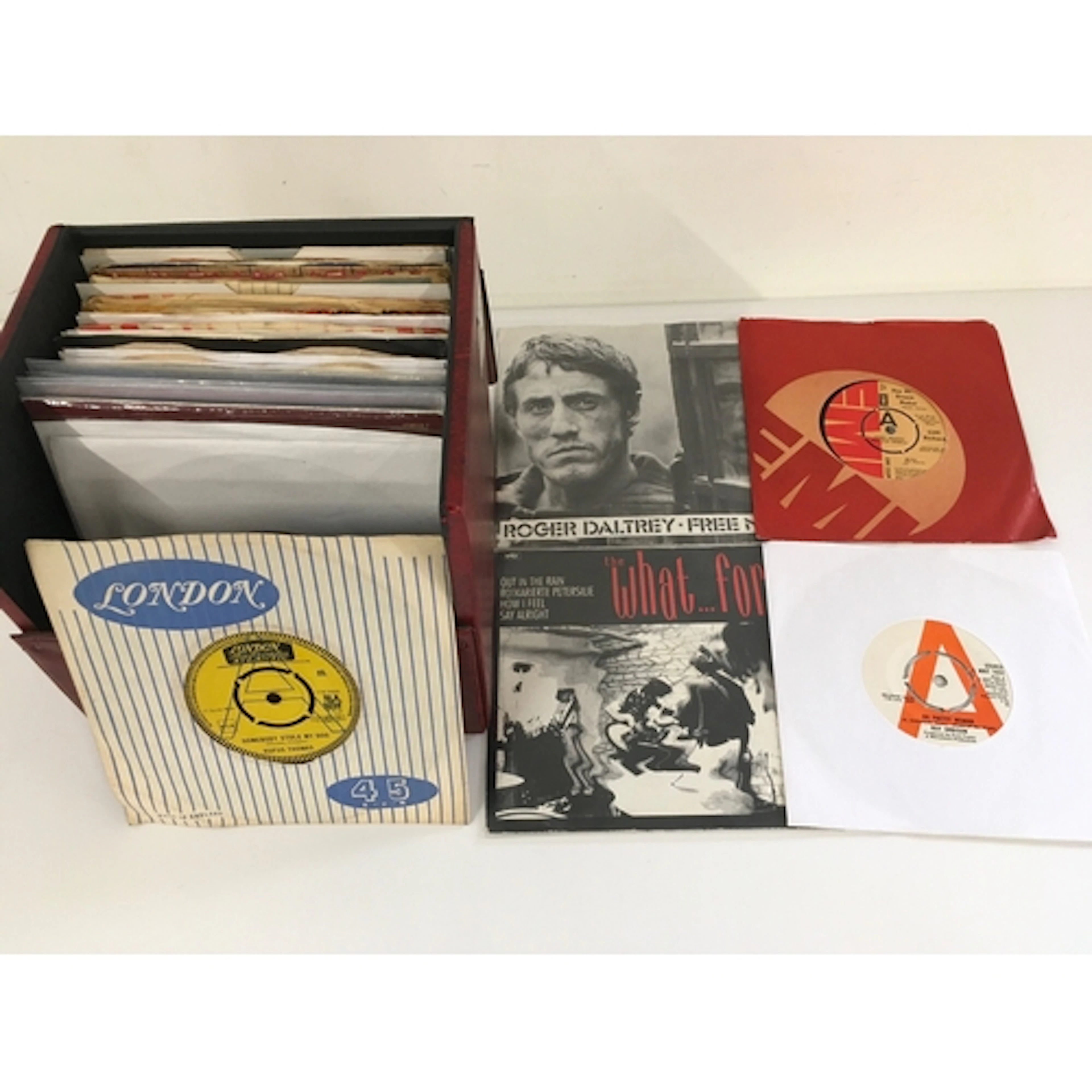 A record case of 7" singles including promo discs. Various a...