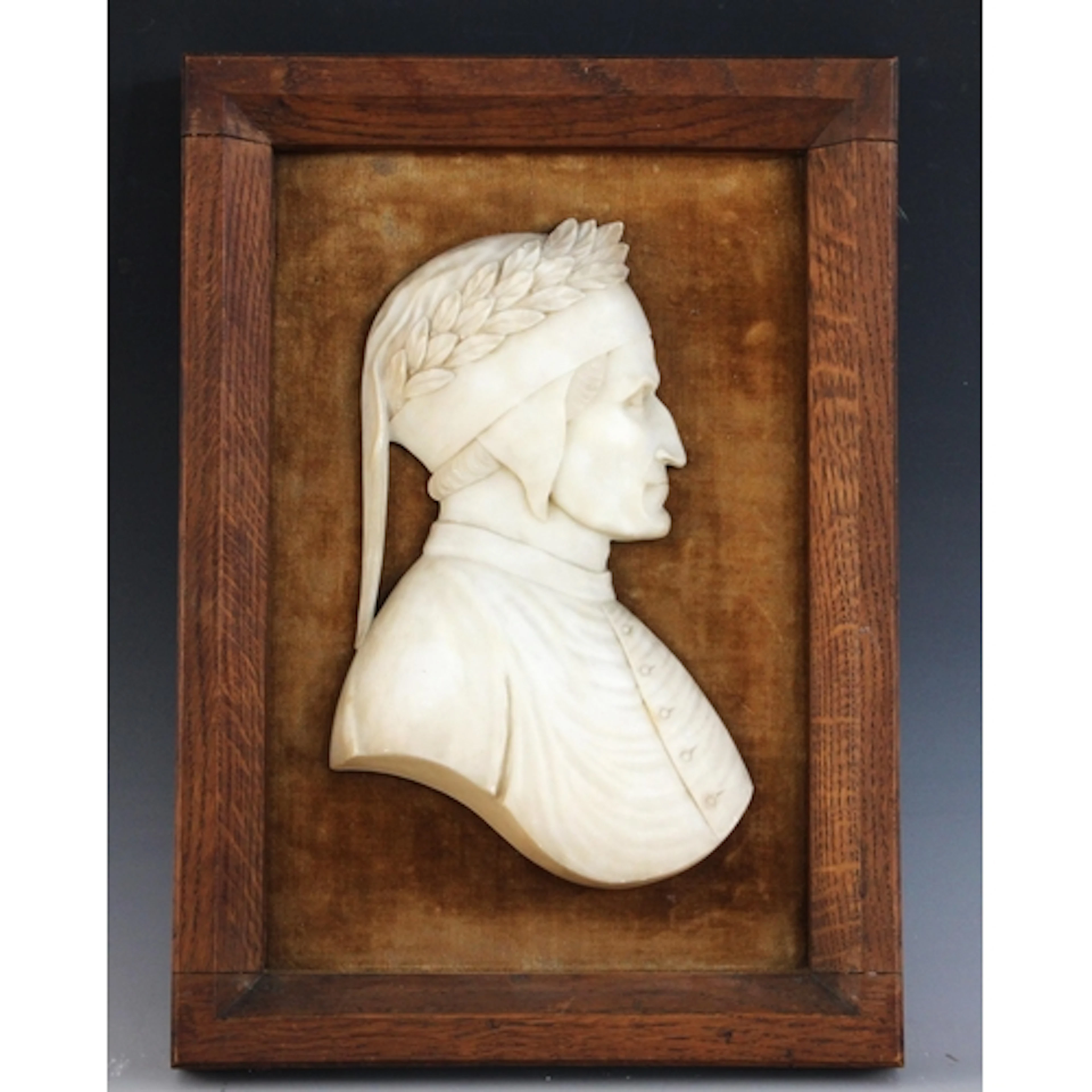 An Italian Grand Tour relief carved marble profile bust mode...