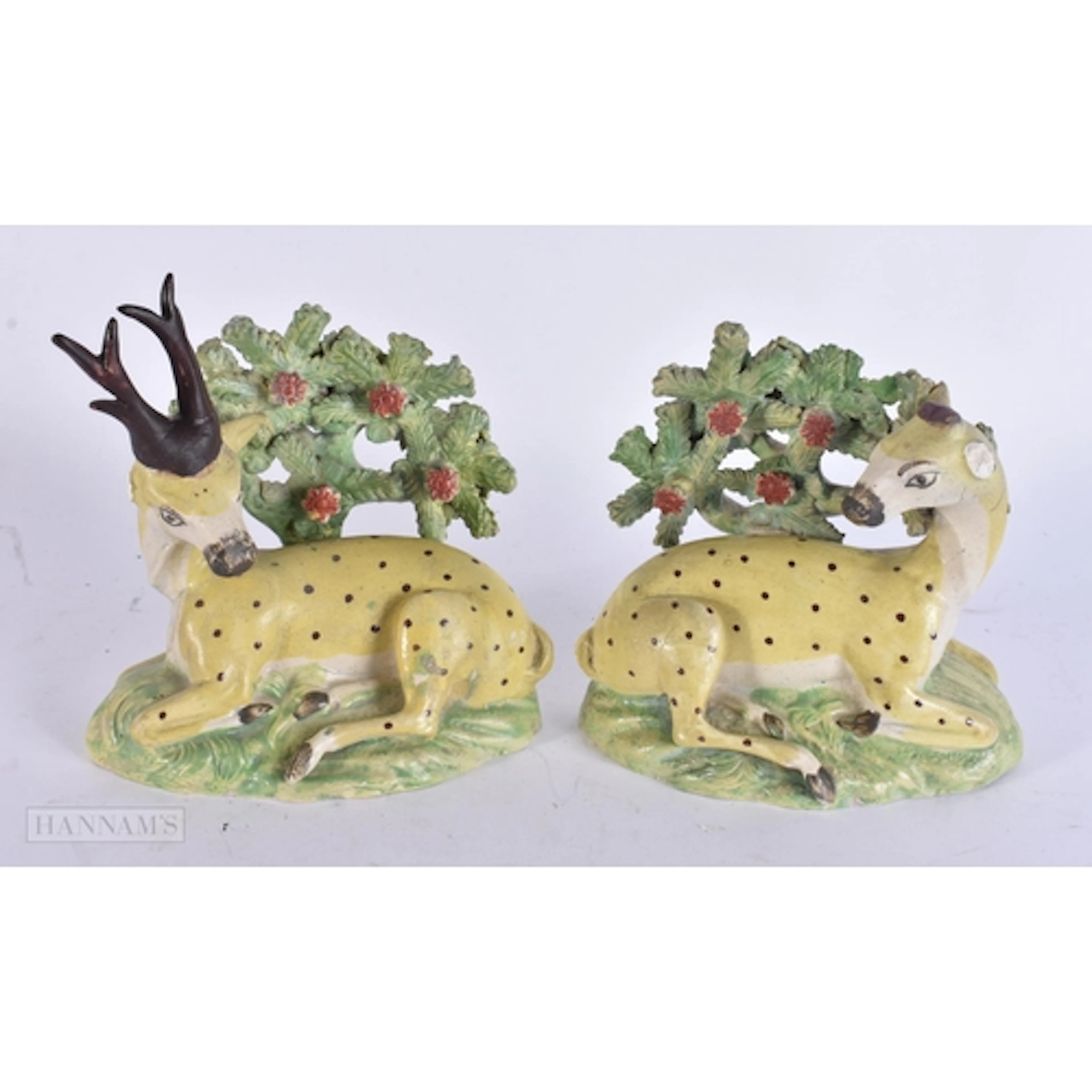 A RARE PAIR OF EARLY 19TH CENTURY STAFFORDSHIRE FIGURES OF S...