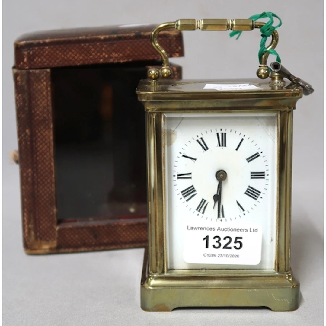 Gilt brass carriage clock, with leather travel case (at faul...