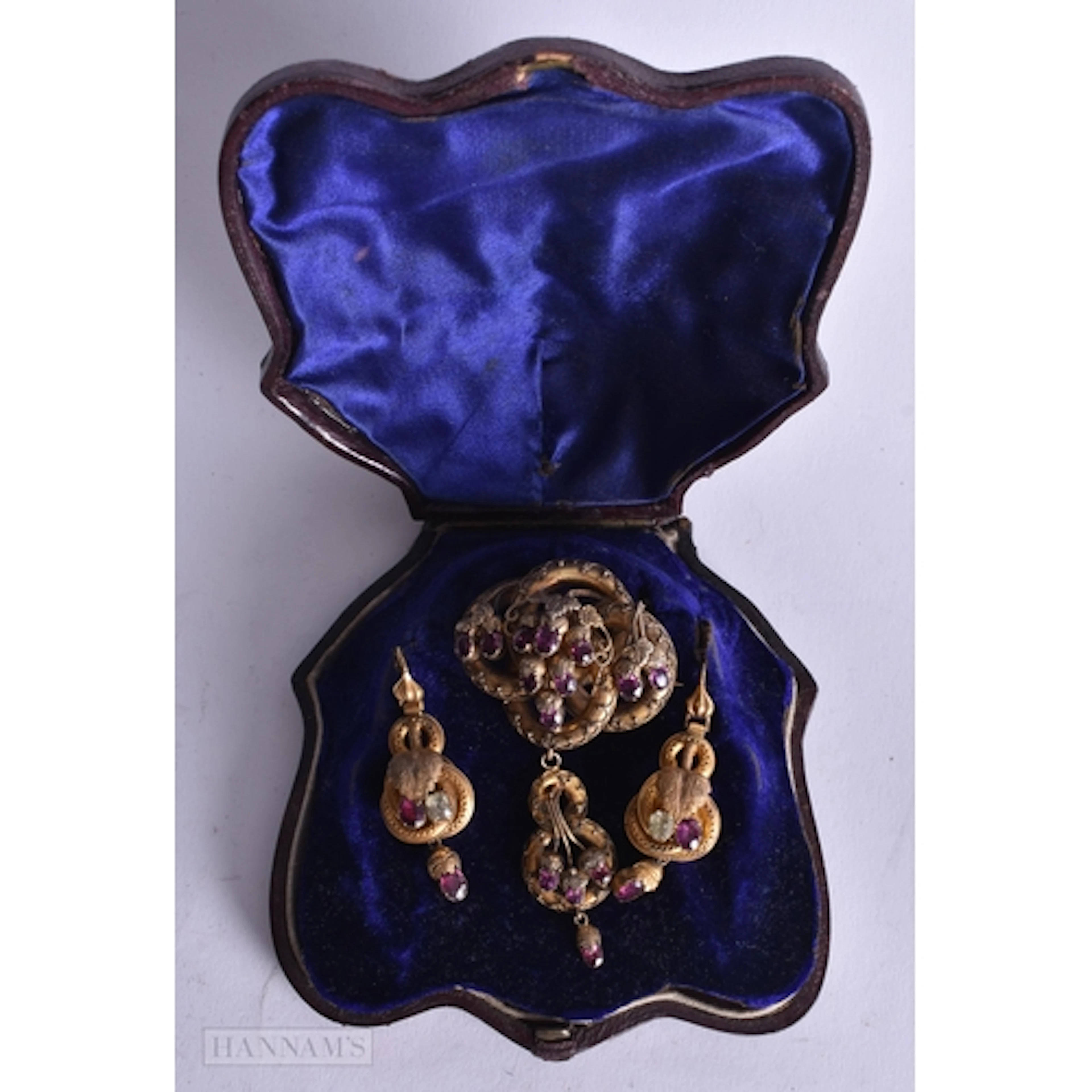 A Set of High Carat Victorian Brooch and Earrings set with R...