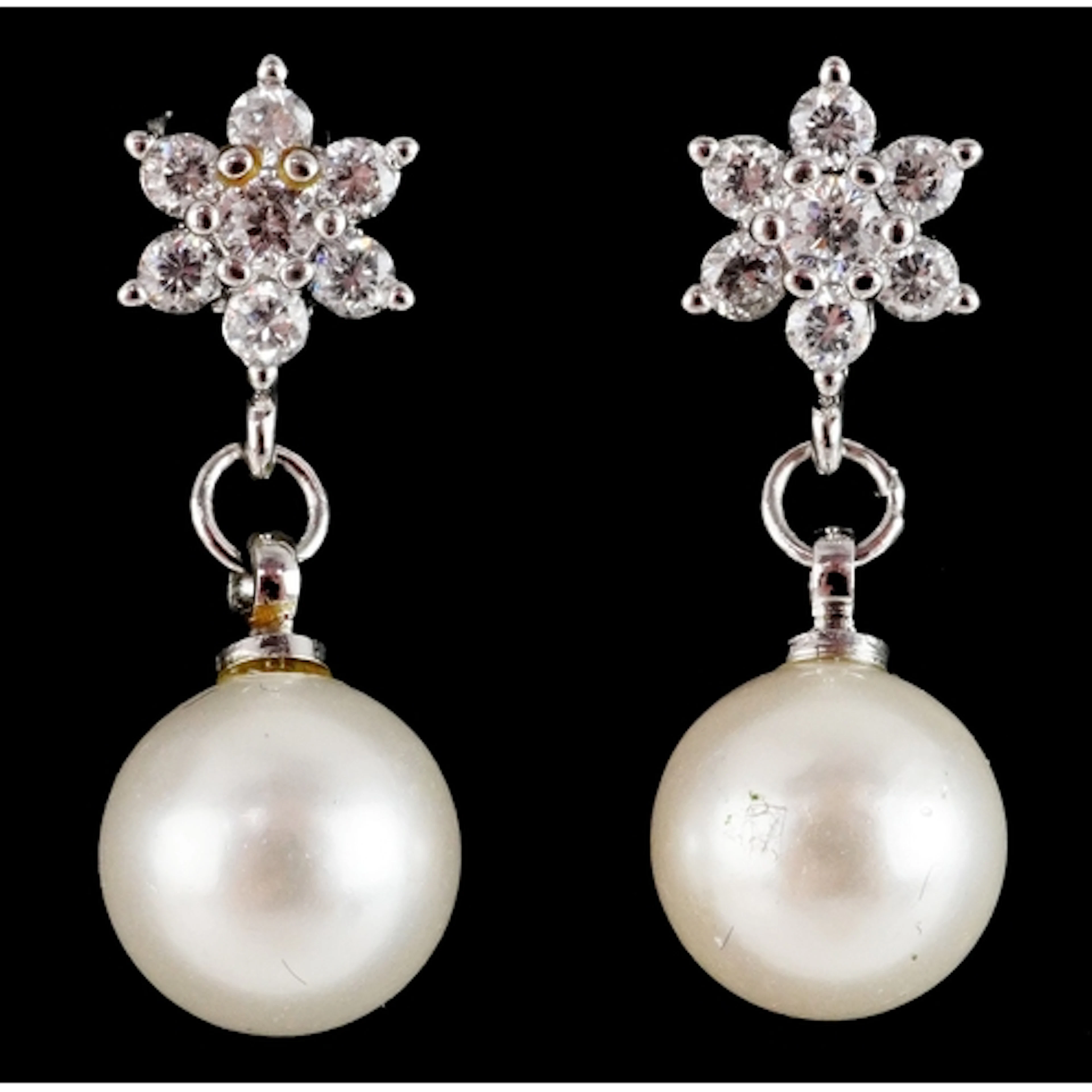 Pair of silver clear stone and simulated pearl drop earrings...
