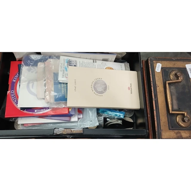 An empty cash tin and a tin of assorted GB coins to include ...