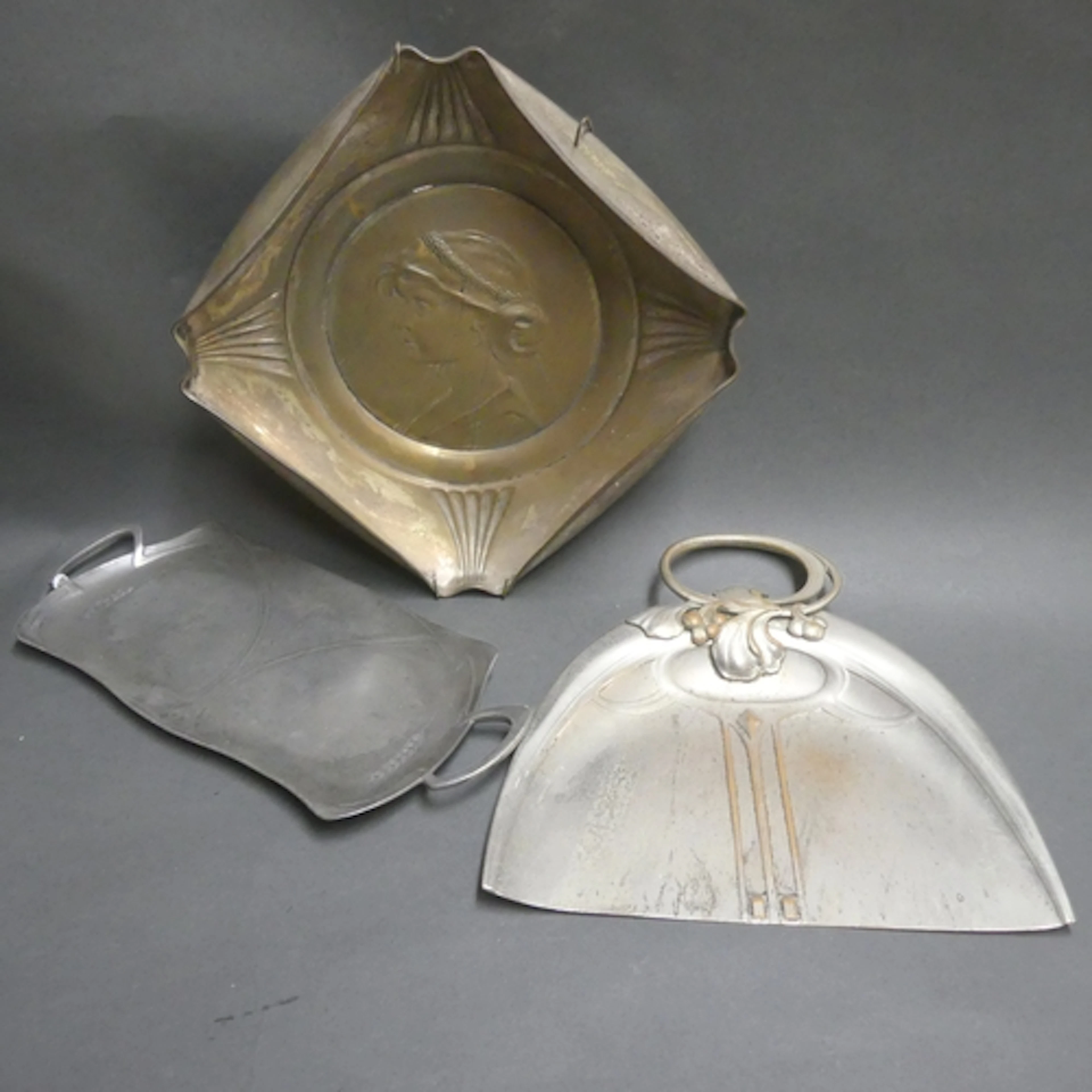 Three pieces of Art Nouveau silver plated ware, including cr...
