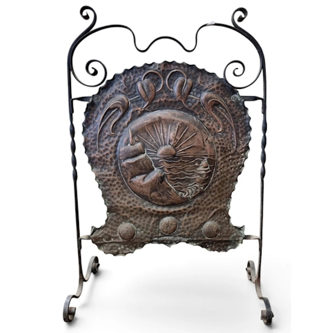 A late 19th Century Arts and Crafts Repousse Copper and Iron...