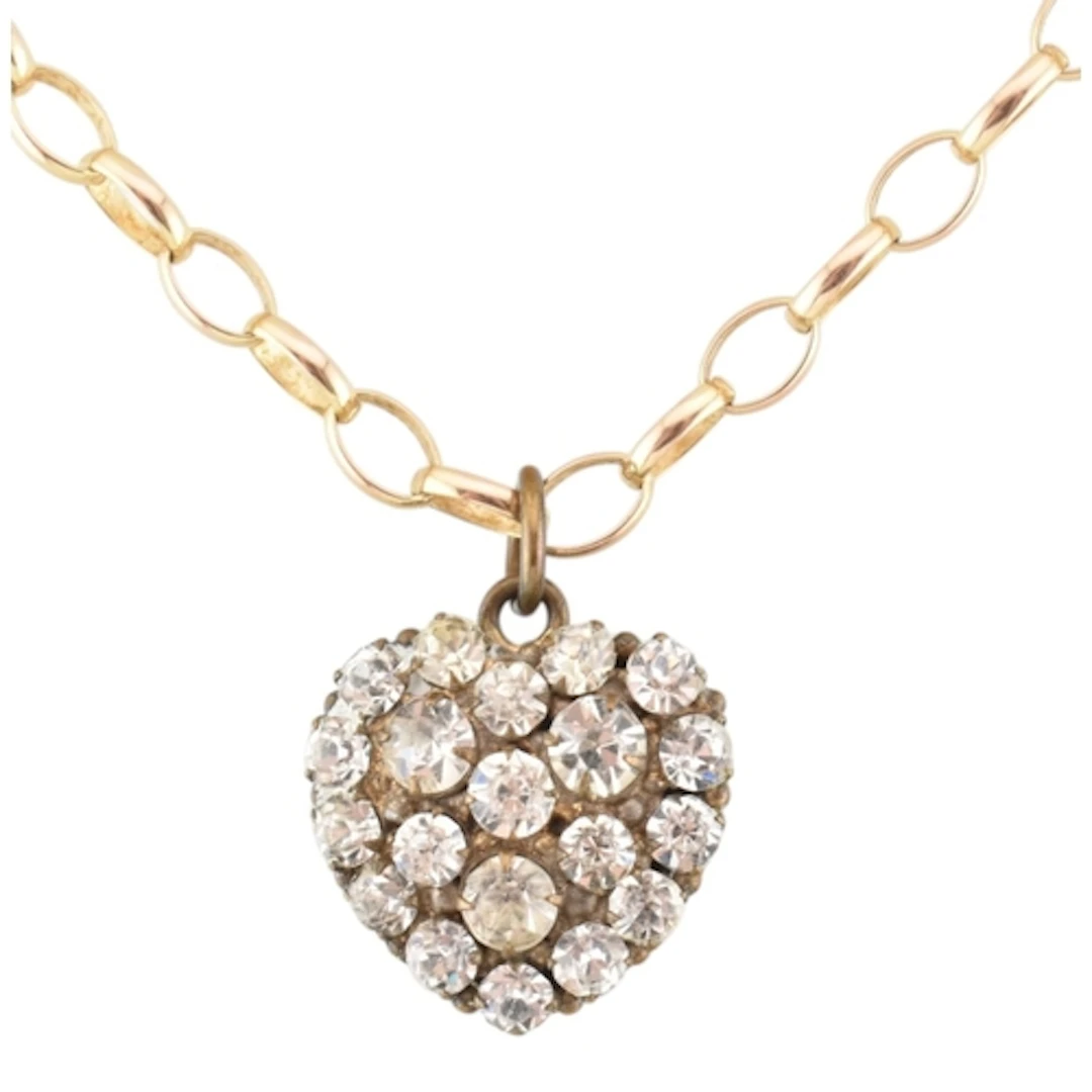 A hallmarked 9ct gold necklace strung with an antique metal ...