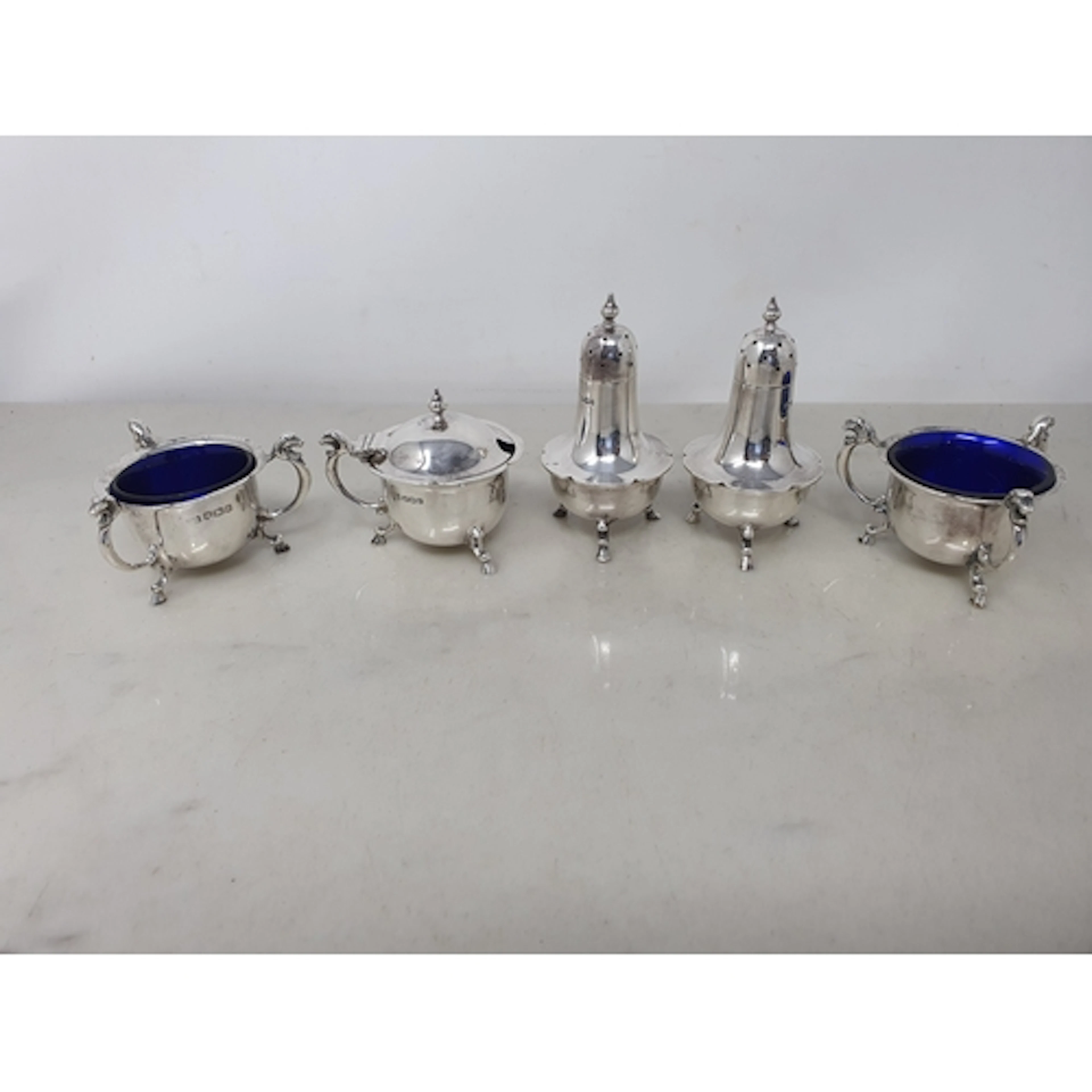 A George V silver five piece Condiment Set, Sheffield 1928, ...