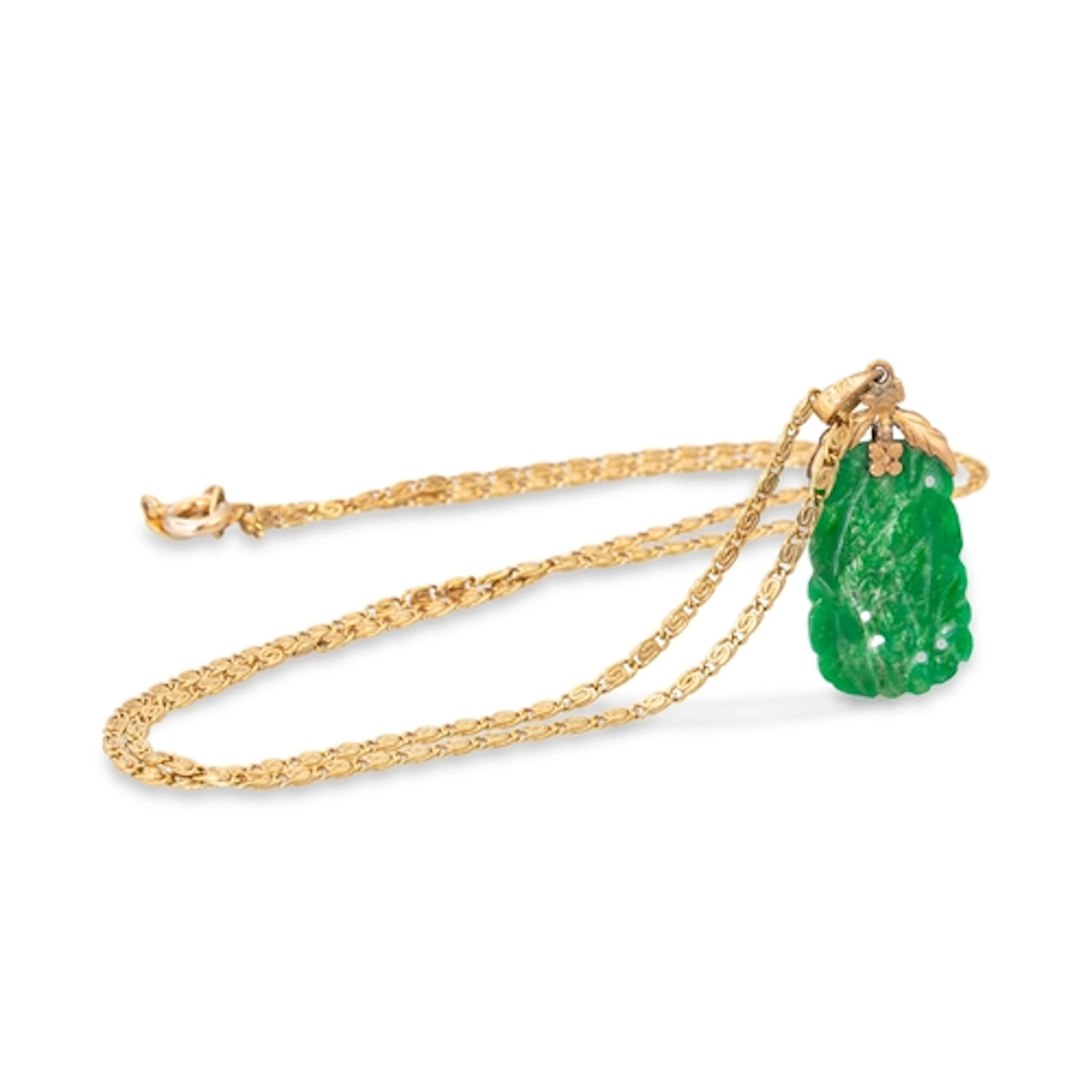 A JADE PENDANT, of carved form, on a 14ct gold chain. gw: 4....