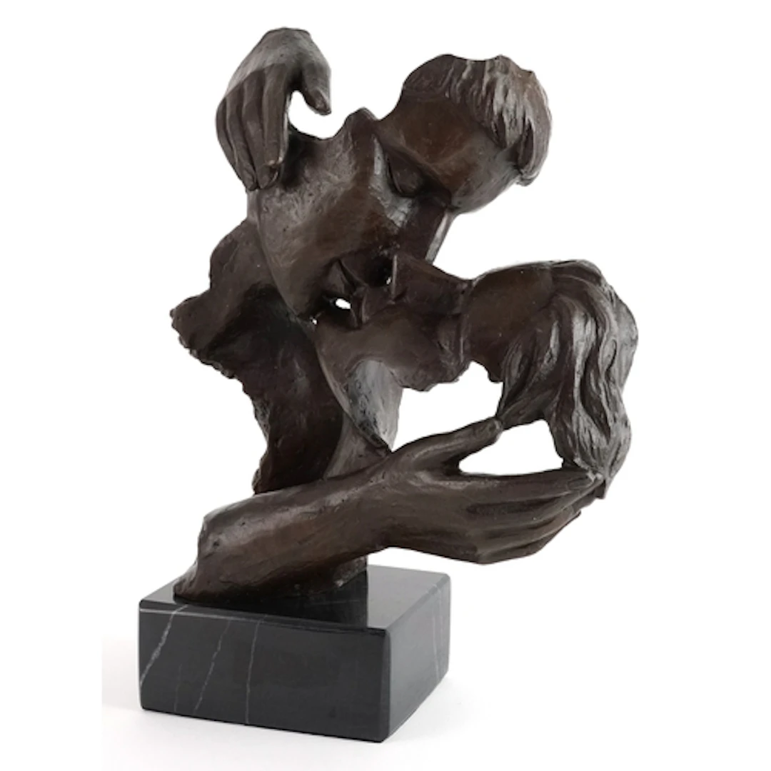 Patinated bronze sculpture of a kissing couple raised on a b...
