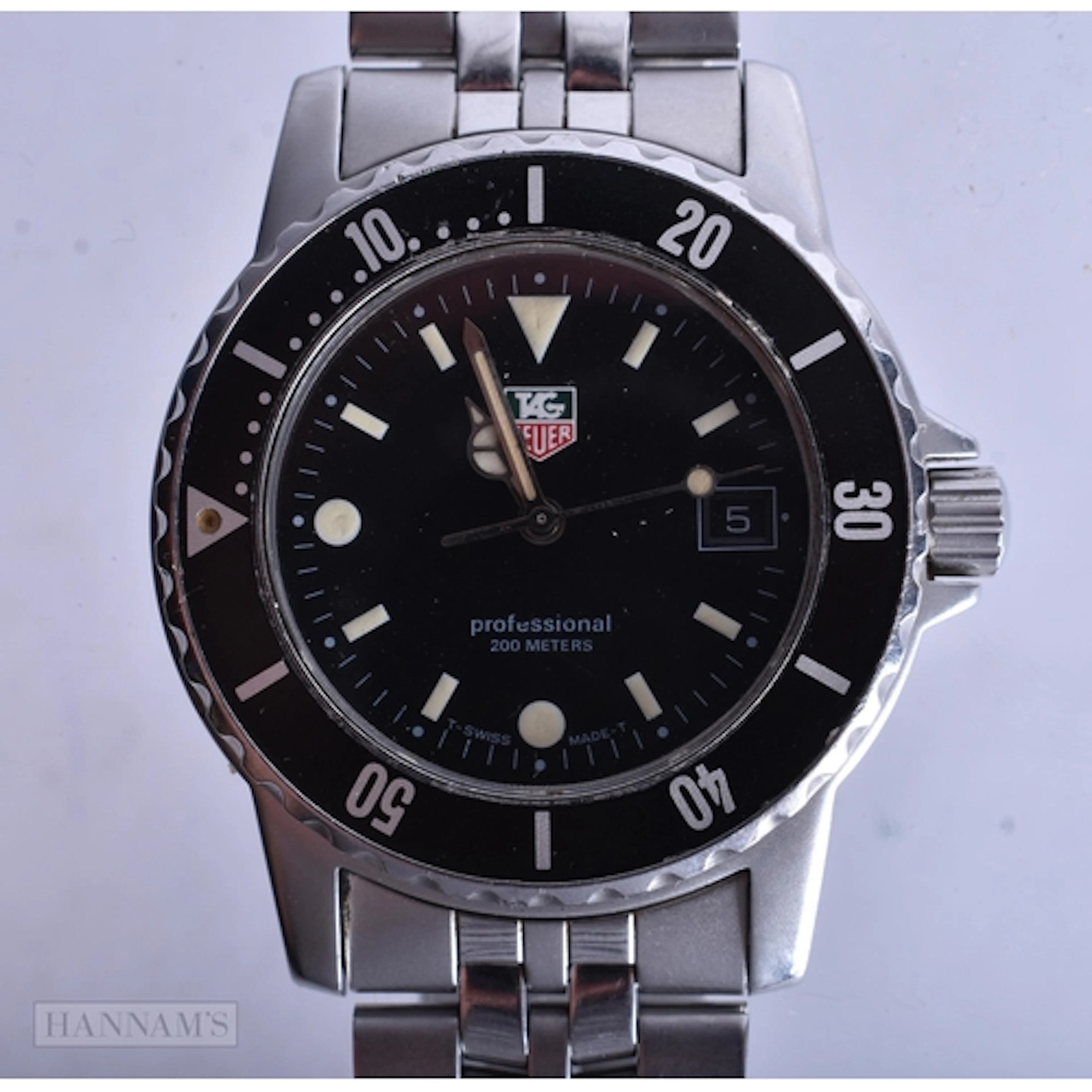 A TAG HEUER WRIST WATCH. Not running. 4 cm wide.