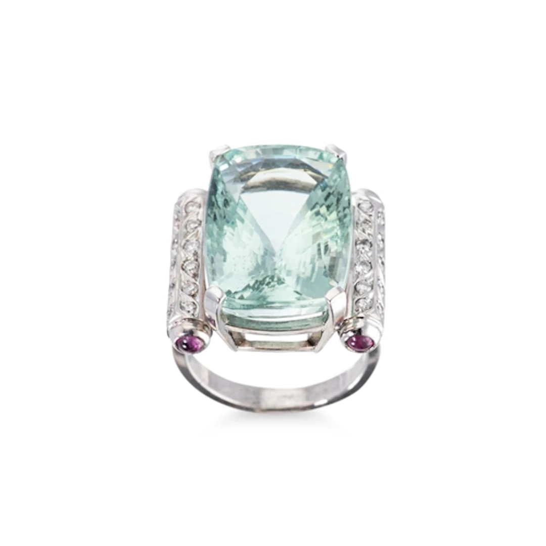 AN AQUAMARINE, DIAMOND & RUBY SET RING, the large rectangula...
