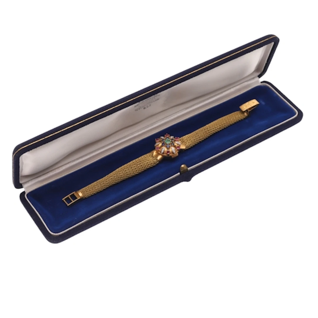 A LADY'S 18CT GOLD AND GEM SET DRESS WRISTWATCH BY OMEGA. th...