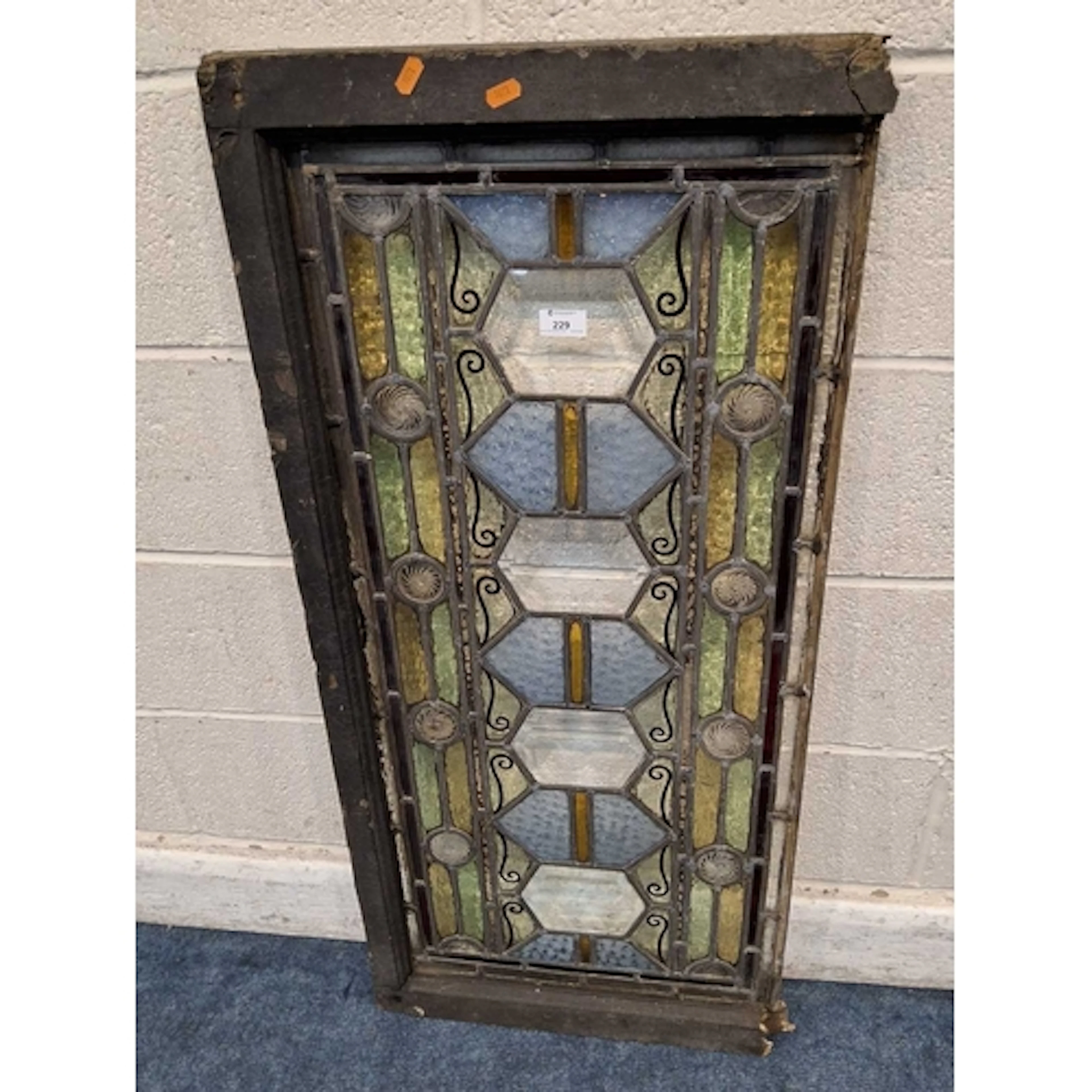 A LEAD GLAZED STAINED GLASS WINDOW, with a distressed timber...