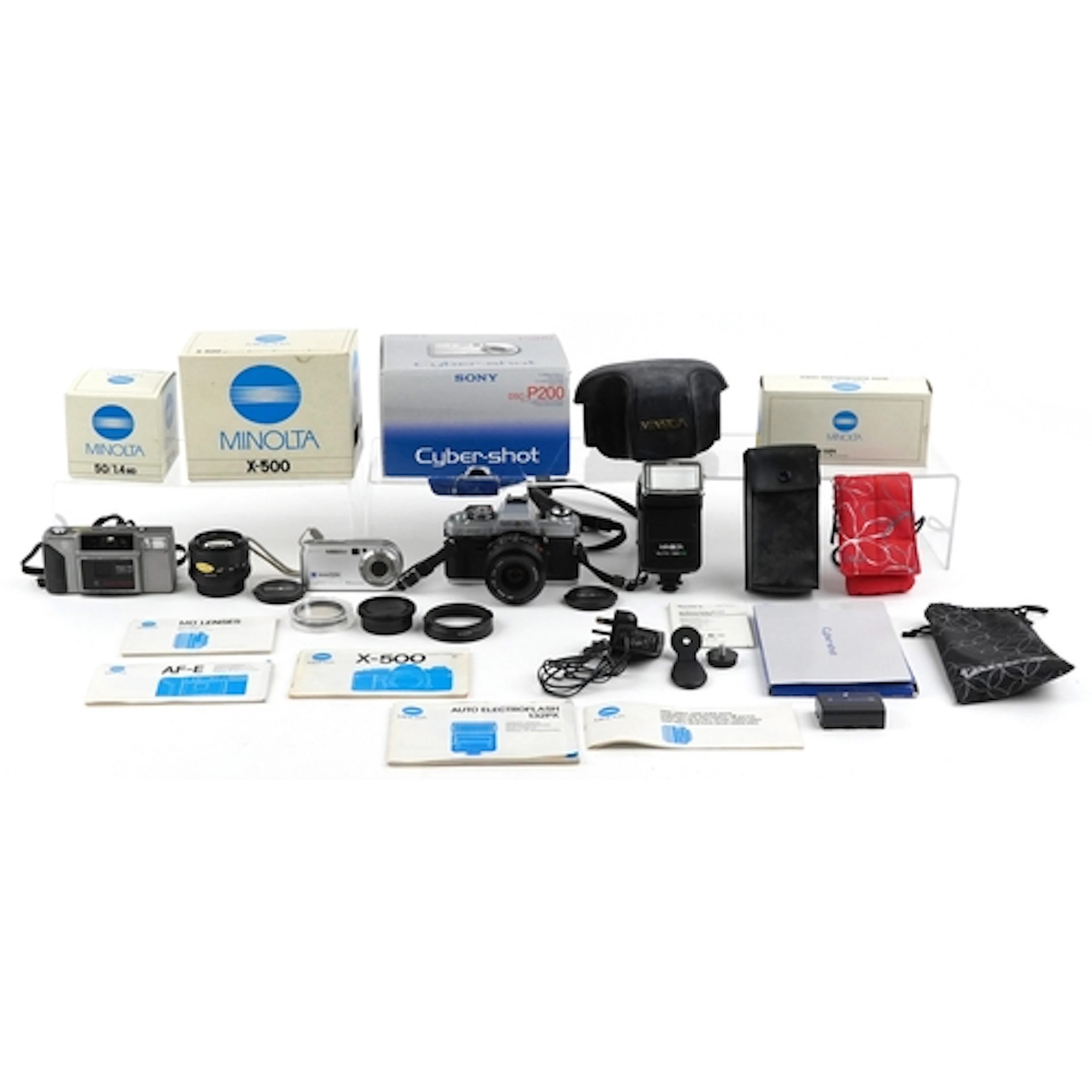 Vintage cameras and accessories comprising Minolta X-500 wit...