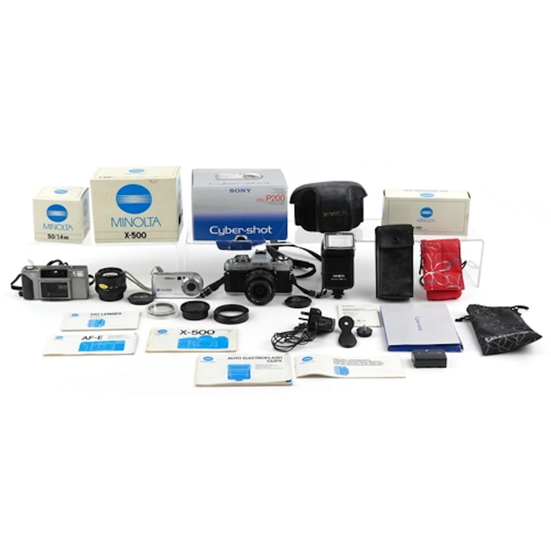 Vintage cameras and accessories comprising Minolta X-500 wit...
