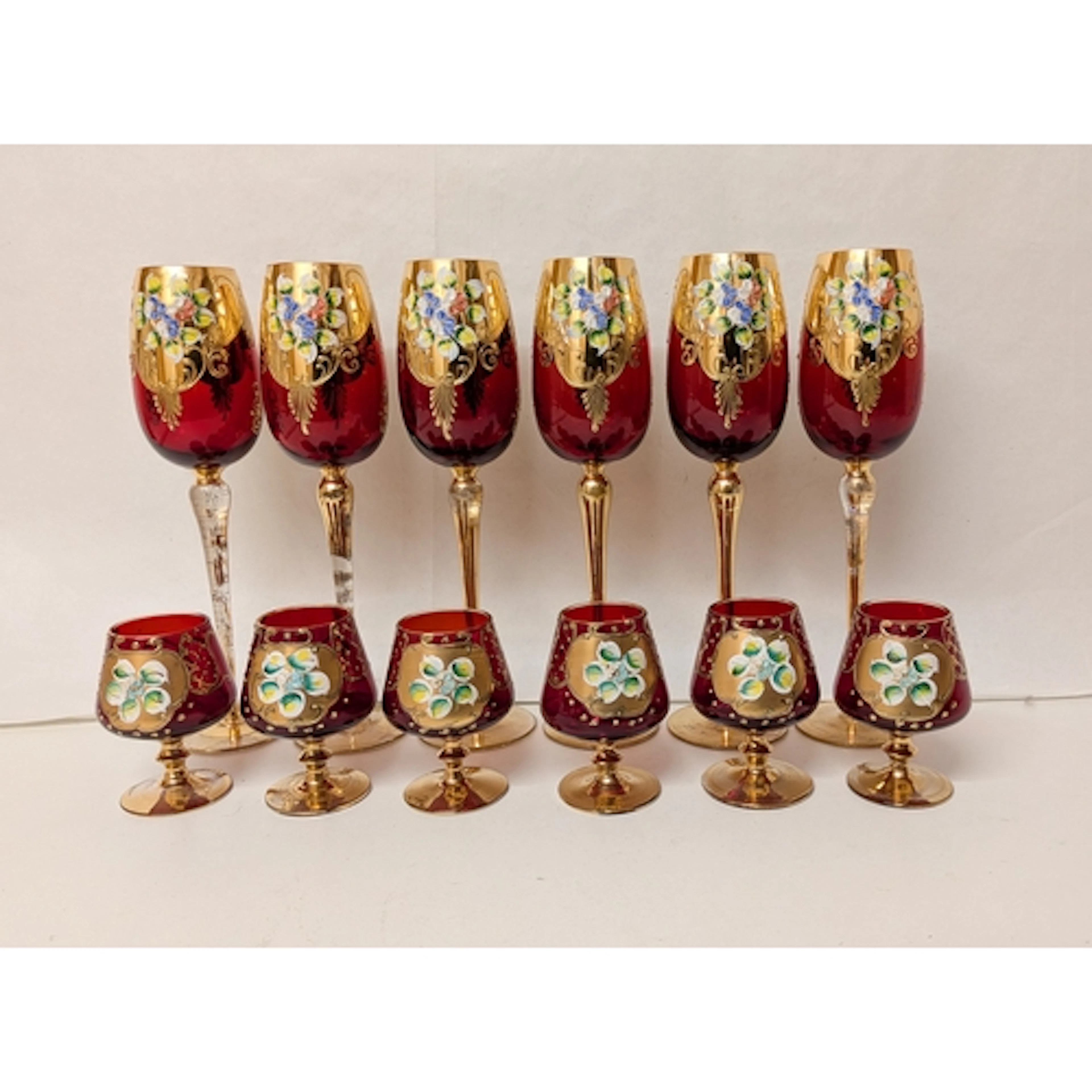 A set of six Bohemian glass and gilt overlaid long stemmed c...